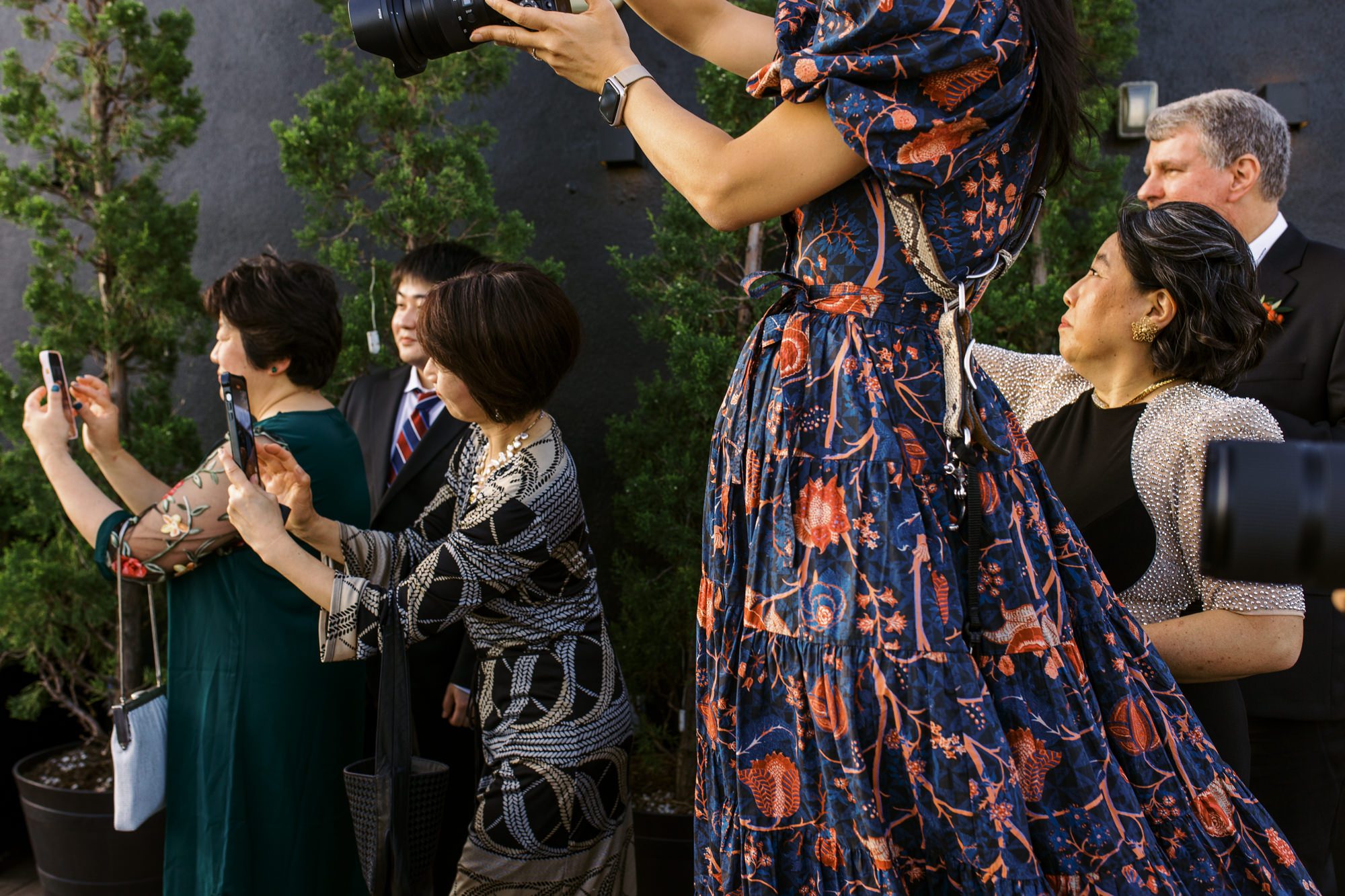 So excited for Erika and Andrei’s wedding day at The Box House Hotel in Brooklyn, NY. This boutique hotel had been on my bucket list for a while, and it did not disappoint! With its unique design, vibrant personality, and incredible rooftop views, The Box House Hotel provided the perfect setting for unique wedding celebration.
The day began with Erika and Andrei getting ready in their respective rooms, surrounded by friends and loved ones. One of the standout features of The Box House Hotel is its boutique charm and eclectic style, blending industrial elements with a cozy, artistic vibe. Erika’s bridal suite, with its floor-to-ceiling windows, was filled with natural light, making it a dream space for capturing those intimate getting-ready moments.
Once everyone was ready, Andrei headed to the rooftop, eagerly waiting to see his bride for the first time. As Erika gracefully approached, her dress swaying in the breeze, Andrei turned around, completely captivated. The two shared a private, heartfelt moment, whispering sweet words to each other, before we moved on to family photos.
The Box House Hotel’s location on a quiet Brooklyn street was perfect for photos. We captured their formal family and bridal party shots right in front of the hotel, showcasing its charming exterior. Then came a unique tradition I’d never witnessed before in my 14+ years of wedding photography! Erika and Andrei brought out a bucket of water filled with coins, and as guests cheered, Erika kicked the bucket as far as she could—a cultural ritual symbolizing good luck and prosperity. It was a joy to photograph and such a fun, memorable moment!
Afterward, we made our way back to the 10,000-square-foot rooftop, which offers unparalleled panoramic views of Manhattan, Brooklyn, and Long Island City. It’s a breathtaking setting for any wedding, leaving guests in awe of the skyline. Friends and family traveled from near and far, including Japan and Romania, to celebrate Erika and Andrei. To honor Erika's Japanese roots, Erika and Andrei incorporated a Japanese tea ceremony officiated by Erika's cousins from Japan. The rooftop was filled with laughter, love, and joy as the ceremony unfolded under the open sky.
As the sun set, the magic of the evening truly came alive. The city skyline twinkled with lights, and the dark sky sparkled with stars. Erika and Andrei danced, laughed, and celebrated late into the night, surrounded by their closest friends and family.
The Box House Hotel is a one-of-a-kind venue, blending urban sophistication with artistic charm. Its rooftop views, boutique-style accommodations, and vibrant atmosphere make it a perfect choice for couples looking to create a unique and unforgettable wedding experience.
Erika and Andrei, thank you for letting me be part of your incredible day. Wishing you a lifetime of love, happiness, and adventure!
Erika and Andrei The Box House Hotel Brooklyn NY Wedding documented by Karis from Hey Karis New York, Brooklyn, Hudson Valley NY and Catskills NY and NJ Wedding and NYC Elopement Photographer.