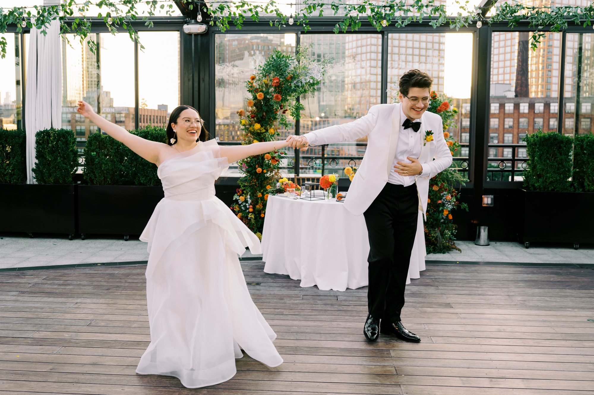 So excited for Erika and Andrei’s wedding day at The Box House Hotel in Brooklyn, NY. This boutique hotel had been on my bucket list for a while, and it did not disappoint! With its unique design, vibrant personality, and incredible rooftop views, The Box House Hotel provided the perfect setting for unique wedding celebration.
The day began with Erika and Andrei getting ready in their respective rooms, surrounded by friends and loved ones. One of the standout features of The Box House Hotel is its boutique charm and eclectic style, blending industrial elements with a cozy, artistic vibe. Erika’s bridal suite, with its floor-to-ceiling windows, was filled with natural light, making it a dream space for capturing those intimate getting-ready moments.
Once everyone was ready, Andrei headed to the rooftop, eagerly waiting to see his bride for the first time. As Erika gracefully approached, her dress swaying in the breeze, Andrei turned around, completely captivated. The two shared a private, heartfelt moment, whispering sweet words to each other, before we moved on to family photos.
The Box House Hotel’s location on a quiet Brooklyn street was perfect for photos. We captured their formal family and bridal party shots right in front of the hotel, showcasing its charming exterior. Then came a unique tradition I’d never witnessed before in my 14+ years of wedding photography! Erika and Andrei brought out a bucket of water filled with coins, and as guests cheered, Erika kicked the bucket as far as she could—a cultural ritual symbolizing good luck and prosperity. It was a joy to photograph and such a fun, memorable moment!
Afterward, we made our way back to the 10,000-square-foot rooftop, which offers unparalleled panoramic views of Manhattan, Brooklyn, and Long Island City. It’s a breathtaking setting for any wedding, leaving guests in awe of the skyline. Friends and family traveled from near and far, including Japan and Romania, to celebrate Erika and Andrei. To honor Erika's Japanese roots, Erika and Andrei incorporated a Japanese tea ceremony officiated by Erika's cousins from Japan. The rooftop was filled with laughter, love, and joy as the ceremony unfolded under the open sky.
As the sun set, the magic of the evening truly came alive. The city skyline twinkled with lights, and the dark sky sparkled with stars. Erika and Andrei danced, laughed, and celebrated late into the night, surrounded by their closest friends and family.
The Box House Hotel is a one-of-a-kind venue, blending urban sophistication with artistic charm. Its rooftop views, boutique-style accommodations, and vibrant atmosphere make it a perfect choice for couples looking to create a unique and unforgettable wedding experience.
Erika and Andrei, thank you for letting me be part of your incredible day. Wishing you a lifetime of love, happiness, and adventure!
Erika and Andrei The Box House Hotel Brooklyn NY Wedding documented by Karis from Hey Karis New York, Brooklyn, Hudson Valley NY and Catskills NY and NJ Wedding and NYC Elopement Photographer.