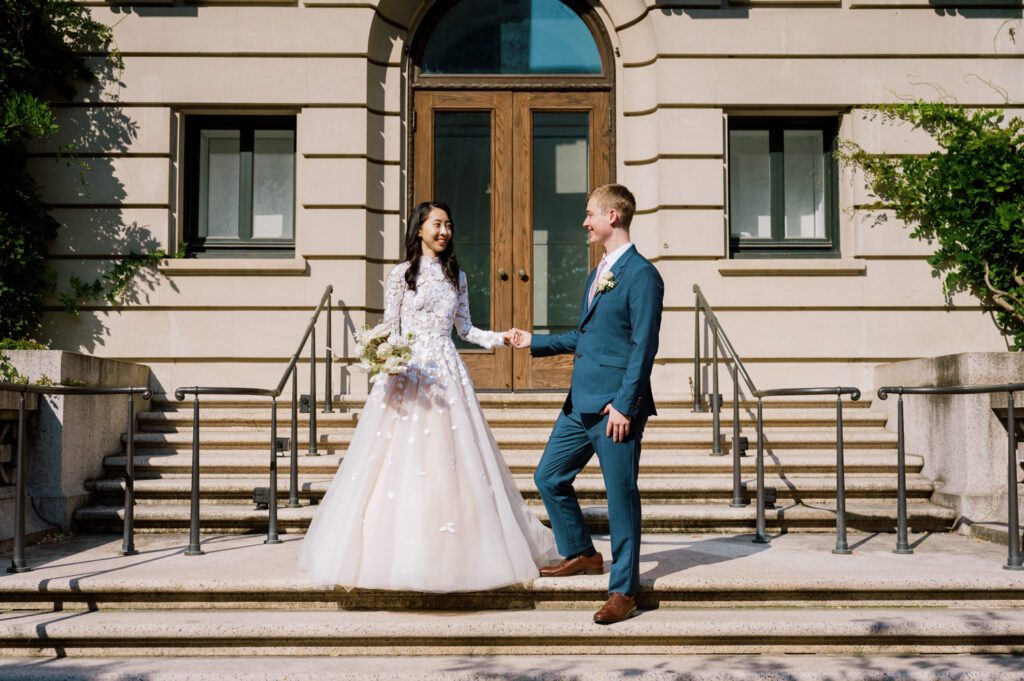 Gorgeous September Wedding at Cooper Hewitt, Smithsonian Design Museum in Manhattan, NY
The breathtaking lawn at the Cooper Hewitt was adorned with a stunning tent and lush greenery. Matching tablecloths and elegant dinnerware were set beneath the tent, creating a sophisticated ambiance. The garden was transformed into a beautiful ceremony space in the heart of Manhattan. Surrounded by towering buildings, it felt almost surreal—a peaceful oasis in the city.
The clinking of champagne glasses and trays of hors d'oeuvres added to the joyous atmosphere as guests savored every moment of the cocktail hour. When the sky darkened, guests moved under the tent for the reception. As night fell, the glow of the candles became warmer and brighter, creating an enchanting setting. The sound of lively conversation and laughter filled the Manhattan air.
Dancing took place inside the historic Cooper Hewitt mansion, where the live band, On The Move Events, delivered an unforgettable performance. Guests enthusiastically filled the dance floor, ending the evening on a high note of celebration and joy.
Thankful for all the wedding vendors that made this day possible:
Planner: @aniwolff_⁠
Venue: @cooperhewitt
Catering: @thomaspretieventstosavor
Tent: @stamford_tent
Lighting: @frostproductionsnyc⁠
Rentals: @sdpr_rentals⁠
Linens: @nuagedesignsinc⁠
Photographer: @heykaris
Videographer: @katiarepinafilms⁠
Florist: @sarahsaundersstudio
Entertainment: @onthemoveevents⁠
Cake: @luckybirdcakes⁠
Officiant: @ourweddingofficiantnyc⁠
Ceremony Strings: @impulsestrings⁠
Stationery: @jensimpsondesign⁠
Favors: @swmsweets
Cooper Hewitt Smithsonian Design Museum Manhattan NY Wedding documented by Karis from Hey Karis New York, Brooklyn, Hudson Valley NY and Catskills NY and NJ Wedding and NYC Elopement Photographer.
