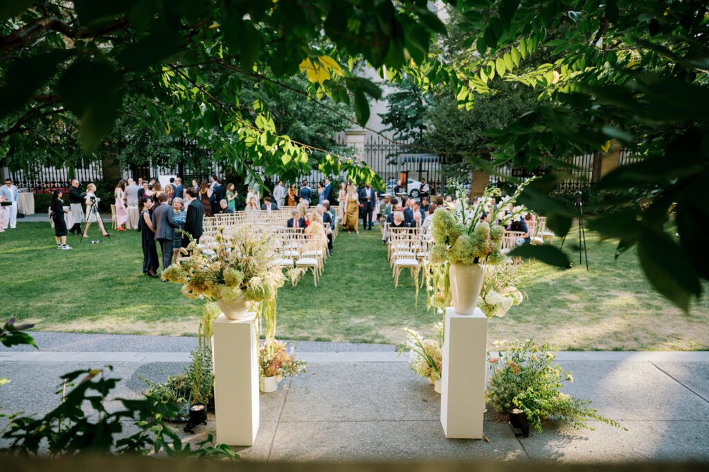Gorgeous September Wedding at Cooper Hewitt, Smithsonian Design Museum in Manhattan, NY
The breathtaking lawn at the Cooper Hewitt was adorned with a stunning tent and lush greenery. Matching tablecloths and elegant dinnerware were set beneath the tent, creating a sophisticated ambiance. The garden was transformed into a beautiful ceremony space in the heart of Manhattan. Surrounded by towering buildings, it felt almost surreal—a peaceful oasis in the city.
The clinking of champagne glasses and trays of hors d'oeuvres added to the joyous atmosphere as guests savored every moment of the cocktail hour. When the sky darkened, guests moved under the tent for the reception. As night fell, the glow of the candles became warmer and brighter, creating an enchanting setting. The sound of lively conversation and laughter filled the Manhattan air.
Dancing took place inside the historic Cooper Hewitt mansion, where the live band, On The Move Events, delivered an unforgettable performance. Guests enthusiastically filled the dance floor, ending the evening on a high note of celebration and joy.
Thankful for all the wedding vendors that made this day possible:
Planner: @aniwolff_⁠
Venue: @cooperhewitt
Catering: @thomaspretieventstosavor
Tent: @stamford_tent
Lighting: @frostproductionsnyc⁠
Rentals: @sdpr_rentals⁠
Linens: @nuagedesignsinc⁠
Photographer: @heykaris
Videographer: @katiarepinafilms⁠
Florist: @sarahsaundersstudio
Entertainment: @onthemoveevents⁠
Cake: @luckybirdcakes⁠
Officiant: @ourweddingofficiantnyc⁠
Ceremony Strings: @impulsestrings⁠
Stationery: @jensimpsondesign⁠
Favors: @swmsweets
Cooper Hewitt Smithsonian Design Museum Manhattan NY Wedding documented by Karis from Hey Karis New York, Brooklyn, Hudson Valley NY and Catskills NY and NJ Wedding and NYC Elopement Photographer.