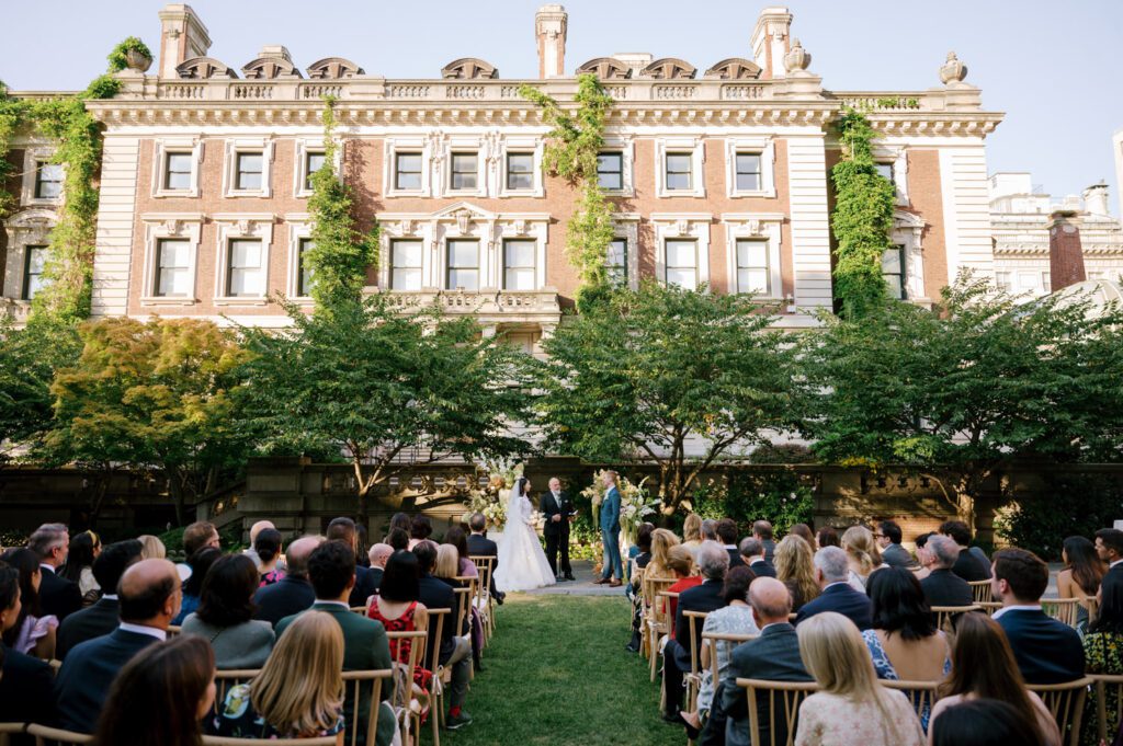 Gorgeous September Wedding at Cooper Hewitt, Smithsonian Design Museum in Manhattan, NY
The breathtaking lawn at the Cooper Hewitt was adorned with a stunning tent and lush greenery. Matching tablecloths and elegant dinnerware were set beneath the tent, creating a sophisticated ambiance. The garden was transformed into a beautiful ceremony space in the heart of Manhattan. Surrounded by towering buildings, it felt almost surreal—a peaceful oasis in the city.
The clinking of champagne glasses and trays of hors d'oeuvres added to the joyous atmosphere as guests savored every moment of the cocktail hour. When the sky darkened, guests moved under the tent for the reception. As night fell, the glow of the candles became warmer and brighter, creating an enchanting setting. The sound of lively conversation and laughter filled the Manhattan air.
Dancing took place inside the historic Cooper Hewitt mansion, where the live band, On The Move Events, delivered an unforgettable performance. Guests enthusiastically filled the dance floor, ending the evening on a high note of celebration and joy.
Thankful for all the wedding vendors that made this day possible:
Planner: @aniwolff_⁠
Venue: @cooperhewitt
Catering: @thomaspretieventstosavor
Tent: @stamford_tent
Lighting: @frostproductionsnyc⁠
Rentals: @sdpr_rentals⁠
Linens: @nuagedesignsinc⁠
Photographer: @heykaris
Videographer: @katiarepinafilms⁠
Florist: @sarahsaundersstudio
Entertainment: @onthemoveevents⁠
Cake: @luckybirdcakes⁠
Officiant: @ourweddingofficiantnyc⁠
Ceremony Strings: @impulsestrings⁠
Stationery: @jensimpsondesign⁠
Favors: @swmsweets
Cooper Hewitt Smithsonian Design Museum Manhattan NY Wedding documented by Karis from Hey Karis New York, Brooklyn, Hudson Valley NY and Catskills NY and NJ Wedding and NYC Elopement Photographer.