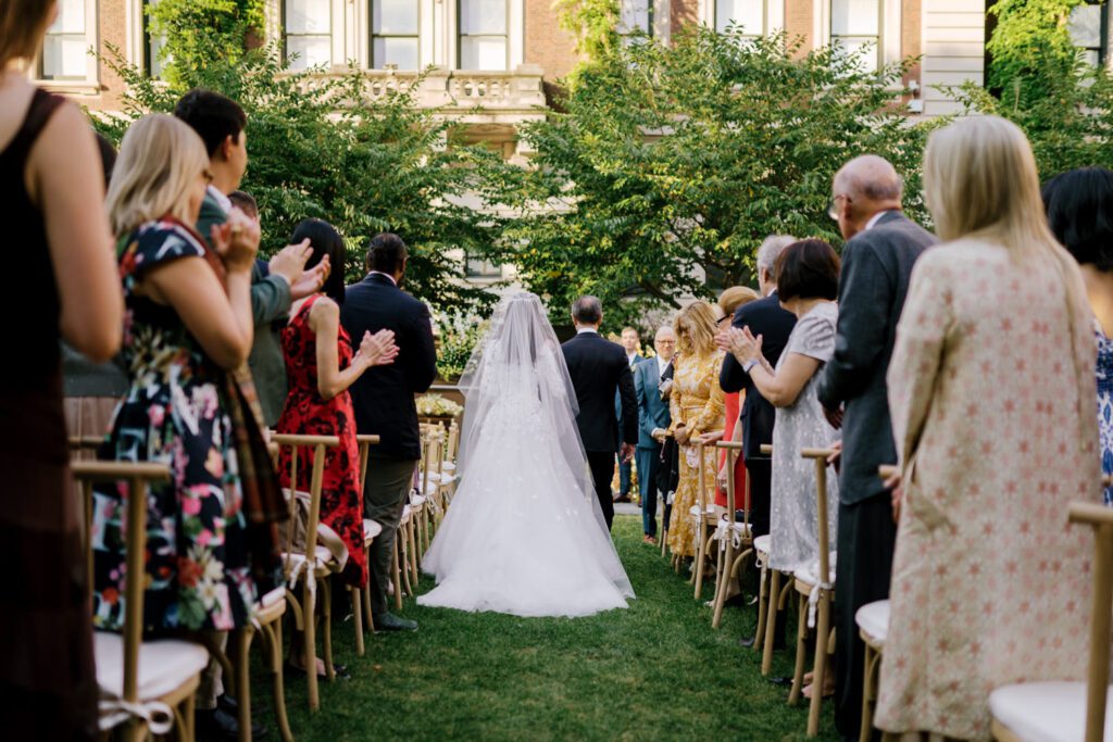 Gorgeous September Wedding at Cooper Hewitt, Smithsonian Design Museum in Manhattan, NY
The breathtaking lawn at the Cooper Hewitt was adorned with a stunning tent and lush greenery. Matching tablecloths and elegant dinnerware were set beneath the tent, creating a sophisticated ambiance. The garden was transformed into a beautiful ceremony space in the heart of Manhattan. Surrounded by towering buildings, it felt almost surreal—a peaceful oasis in the city.
The clinking of champagne glasses and trays of hors d'oeuvres added to the joyous atmosphere as guests savored every moment of the cocktail hour. When the sky darkened, guests moved under the tent for the reception. As night fell, the glow of the candles became warmer and brighter, creating an enchanting setting. The sound of lively conversation and laughter filled the Manhattan air.
Dancing took place inside the historic Cooper Hewitt mansion, where the live band, On The Move Events, delivered an unforgettable performance. Guests enthusiastically filled the dance floor, ending the evening on a high note of celebration and joy.
Thankful for all the wedding vendors that made this day possible:
Planner: @aniwolff_⁠
Venue: @cooperhewitt
Catering: @thomaspretieventstosavor
Tent: @stamford_tent
Lighting: @frostproductionsnyc⁠
Rentals: @sdpr_rentals⁠
Linens: @nuagedesignsinc⁠
Photographer: @heykaris
Videographer: @katiarepinafilms⁠
Florist: @sarahsaundersstudio
Entertainment: @onthemoveevents⁠
Cake: @luckybirdcakes⁠
Officiant: @ourweddingofficiantnyc⁠
Ceremony Strings: @impulsestrings⁠
Stationery: @jensimpsondesign⁠
Favors: @swmsweets
Cooper Hewitt Smithsonian Design Museum Manhattan NY Wedding documented by Karis from Hey Karis New York, Brooklyn, Hudson Valley NY and Catskills NY and NJ Wedding and NYC Elopement Photographer.