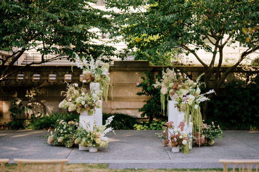 Gorgeous September Wedding at Cooper Hewitt, Smithsonian Design Museum in Manhattan, NY
The breathtaking lawn at the Cooper Hewitt was adorned with a stunning tent and lush greenery. Matching tablecloths and elegant dinnerware were set beneath the tent, creating a sophisticated ambiance. The garden was transformed into a beautiful ceremony space in the heart of Manhattan. Surrounded by towering buildings, it felt almost surreal—a peaceful oasis in the city.
The clinking of champagne glasses and trays of hors d'oeuvres added to the joyous atmosphere as guests savored every moment of the cocktail hour. When the sky darkened, guests moved under the tent for the reception. As night fell, the glow of the candles became warmer and brighter, creating an enchanting setting. The sound of lively conversation and laughter filled the Manhattan air.
Dancing took place inside the historic Cooper Hewitt mansion, where the live band, On The Move Events, delivered an unforgettable performance. Guests enthusiastically filled the dance floor, ending the evening on a high note of celebration and joy.
Thankful for all the wedding vendors that made this day possible:
Planner: @aniwolff_⁠
Venue: @cooperhewitt
Catering: @thomaspretieventstosavor
Tent: @stamford_tent
Lighting: @frostproductionsnyc⁠
Rentals: @sdpr_rentals⁠
Linens: @nuagedesignsinc⁠
Photographer: @heykaris
Videographer: @katiarepinafilms⁠
Florist: @sarahsaundersstudio
Entertainment: @onthemoveevents⁠
Cake: @luckybirdcakes⁠
Officiant: @ourweddingofficiantnyc⁠
Ceremony Strings: @impulsestrings⁠
Stationery: @jensimpsondesign⁠
Favors: @swmsweets
Cooper Hewitt Smithsonian Design Museum Manhattan NY Wedding documented by Karis from Hey Karis New York, Brooklyn, Hudson Valley NY and Catskills NY and NJ Wedding and NYC Elopement Photographer.