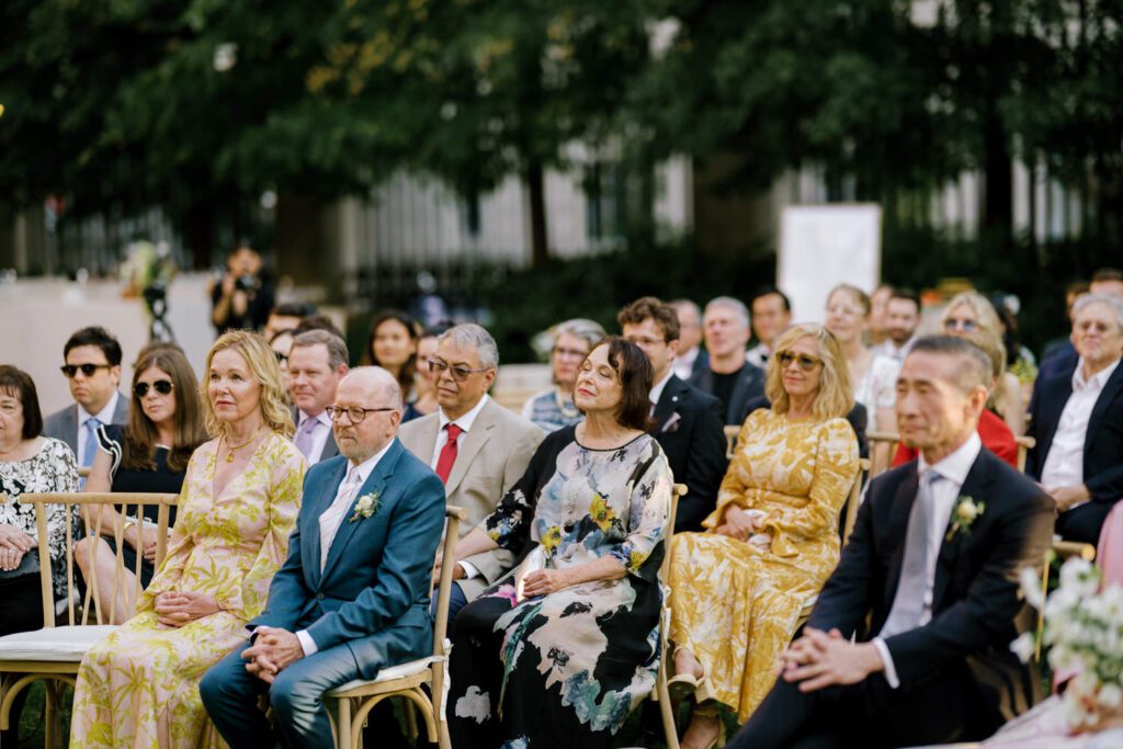 Gorgeous September Wedding at Cooper Hewitt, Smithsonian Design Museum in Manhattan, NY
The breathtaking lawn at the Cooper Hewitt was adorned with a stunning tent and lush greenery. Matching tablecloths and elegant dinnerware were set beneath the tent, creating a sophisticated ambiance. The garden was transformed into a beautiful ceremony space in the heart of Manhattan. Surrounded by towering buildings, it felt almost surreal—a peaceful oasis in the city.
The clinking of champagne glasses and trays of hors d'oeuvres added to the joyous atmosphere as guests savored every moment of the cocktail hour. When the sky darkened, guests moved under the tent for the reception. As night fell, the glow of the candles became warmer and brighter, creating an enchanting setting. The sound of lively conversation and laughter filled the Manhattan air.
Dancing took place inside the historic Cooper Hewitt mansion, where the live band, On The Move Events, delivered an unforgettable performance. Guests enthusiastically filled the dance floor, ending the evening on a high note of celebration and joy.
Thankful for all the wedding vendors that made this day possible:
Planner: @aniwolff_⁠
Venue: @cooperhewitt
Catering: @thomaspretieventstosavor
Tent: @stamford_tent
Lighting: @frostproductionsnyc⁠
Rentals: @sdpr_rentals⁠
Linens: @nuagedesignsinc⁠
Photographer: @heykaris
Videographer: @katiarepinafilms⁠
Florist: @sarahsaundersstudio
Entertainment: @onthemoveevents⁠
Cake: @luckybirdcakes⁠
Officiant: @ourweddingofficiantnyc⁠
Ceremony Strings: @impulsestrings⁠
Stationery: @jensimpsondesign⁠
Favors: @swmsweets
Cooper Hewitt Smithsonian Design Museum Manhattan NY Wedding documented by Karis from Hey Karis New York, Brooklyn, Hudson Valley NY and Catskills NY and NJ Wedding and NYC Elopement Photographer.