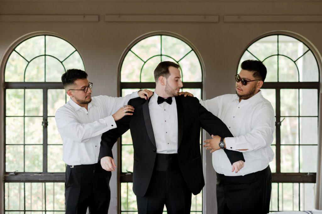 Vivian and Josh’s Gorgeous September Wedding at Arrow Park, NY
There’s something truly special about Arrow Park—it feels like my home away from home, and Vivian and Josh’s beautiful September wedding perfectly showcased everything this venue has to offer. Their blended celebration, honoring Vivian’s Korean heritage and Josh’s Jewish background, was a heartfelt and unforgettable day.
The couple beautifully wove their cultures into the festivities, from breaking the glass at the end of their garden ceremony to the lively horah during the reception. Later, Vivian and Josh delighted their guests by changing into traditional Korean hanbok outfits, a touching nod to her heritage.
Arrow Park: A Dream Venue for Multi-Day WeddingsVivian, Josh, and their loved ones all got ready at Arrow Park, which offers plenty of spacious accommodations for family and friends. This made it the perfect choice for their multi-day celebration. With its stunning grounds and versatile spaces, Arrow Park is ideal for couples seeking a wedding weekend filled with both elegance and comfort.
A Scenic September CelebrationThanks to the pleasant September weather, Vivian and Josh made full use of Arrow Park’s breathtaking grounds. Their day began with a magical first look along the iconic driveway lined with towering trees. From there, we explored the garden with its charming sculptures, captured moments by the ceremony’s floral décor, and took stunning portraits on the mansion’s iconic back staircase bathed in perfect lighting. We also ventured indoors for photos in the library and the Green Room, taking advantage of the mansion’s timeless charm.
As family and friends gathered, we captured formal portraits in front of the grand mansion before the ceremony began.
A Ceremony and Reception to RememberThe ceremony was set in the picturesque garden, where Jenny from Field Trip Flowers created a breathtaking floral backdrop that perfectly complemented the natural beauty of Arrow Park.
Afterward, guests strolled back to the mansion for a warm and inviting cocktail hour on the main floor. Later, everyone gathered in the courtyard for an enchanting outdoor reception under twinkling café lights. The space felt intimate yet grand, with the perfect blend of rustic elegance and romance.
Arrow Park’s charm, coupled with Vivian and Josh’s thoughtful cultural details, made this wedding one to remember. It’s the kind of venue where dreams come true—a hidden gem that’s ready to host your perfect day.
  
Thankful for all the wedding vendors that made this day possible:⁠
Venue: @arrowparkny
Floral: @fieldtripflowers
Catering: @lovenrosemary

Vivian and Josh Arrow Park NY Wedding documented by Karis from Hey Karis New York, Brooklyn, Hudson Valley NY and Catskills NY and NJ Wedding and NYC Elopement Photographer.