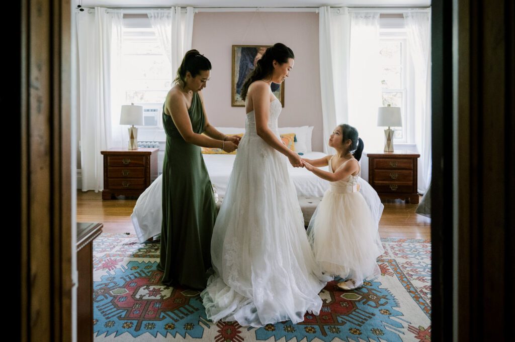 Vivian and Josh’s Gorgeous September Wedding at Arrow Park, NY
There’s something truly special about Arrow Park—it feels like my home away from home, and Vivian and Josh’s beautiful September wedding perfectly showcased everything this venue has to offer. Their blended celebration, honoring Vivian’s Korean heritage and Josh’s Jewish background, was a heartfelt and unforgettable day.
The couple beautifully wove their cultures into the festivities, from breaking the glass at the end of their garden ceremony to the lively horah during the reception. Later, Vivian and Josh delighted their guests by changing into traditional Korean hanbok outfits, a touching nod to her heritage.
Arrow Park: A Dream Venue for Multi-Day WeddingsVivian, Josh, and their loved ones all got ready at Arrow Park, which offers plenty of spacious accommodations for family and friends. This made it the perfect choice for their multi-day celebration. With its stunning grounds and versatile spaces, Arrow Park is ideal for couples seeking a wedding weekend filled with both elegance and comfort.
A Scenic September CelebrationThanks to the pleasant September weather, Vivian and Josh made full use of Arrow Park’s breathtaking grounds. Their day began with a magical first look along the iconic driveway lined with towering trees. From there, we explored the garden with its charming sculptures, captured moments by the ceremony’s floral décor, and took stunning portraits on the mansion’s iconic back staircase bathed in perfect lighting. We also ventured indoors for photos in the library and the Green Room, taking advantage of the mansion’s timeless charm.
As family and friends gathered, we captured formal portraits in front of the grand mansion before the ceremony began.
A Ceremony and Reception to RememberThe ceremony was set in the picturesque garden, where Jenny from Field Trip Flowers created a breathtaking floral backdrop that perfectly complemented the natural beauty of Arrow Park.
Afterward, guests strolled back to the mansion for a warm and inviting cocktail hour on the main floor. Later, everyone gathered in the courtyard for an enchanting outdoor reception under twinkling café lights. The space felt intimate yet grand, with the perfect blend of rustic elegance and romance.
Arrow Park’s charm, coupled with Vivian and Josh’s thoughtful cultural details, made this wedding one to remember. It’s the kind of venue where dreams come true—a hidden gem that’s ready to host your perfect day.
  
Thankful for all the wedding vendors that made this day possible:⁠
Venue: @arrowparkny
Floral: @fieldtripflowers
Catering: @lovenrosemary

Vivian and Josh Arrow Park NY Wedding documented by Karis from Hey Karis New York, Brooklyn, Hudson Valley NY and Catskills NY and NJ Wedding and NYC Elopement Photographer.