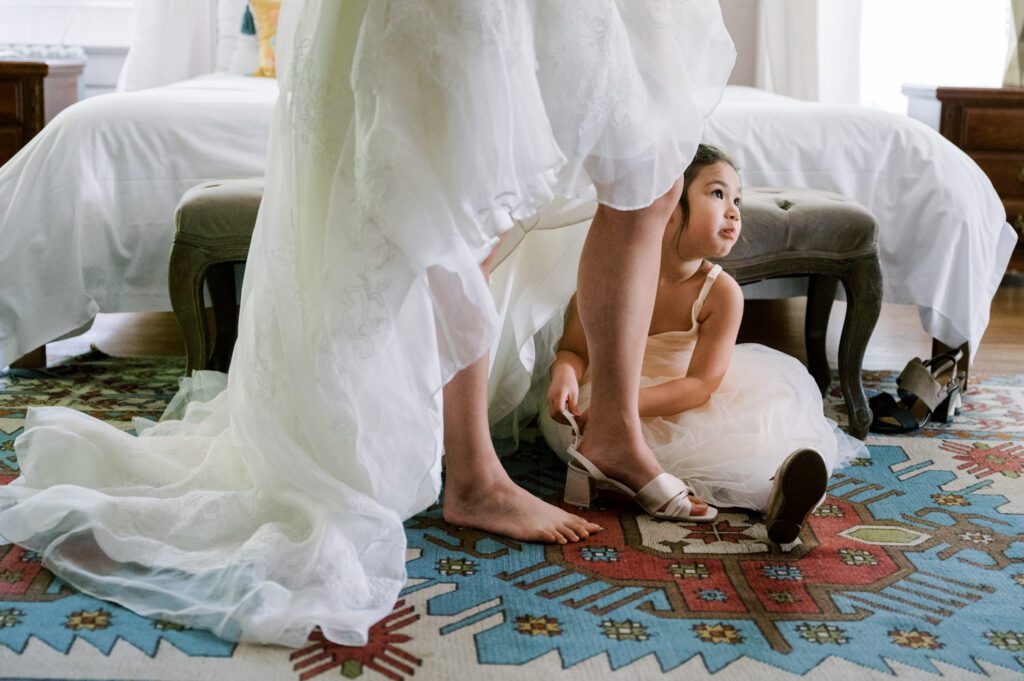 Vivian and Josh’s Gorgeous September Wedding at Arrow Park, NY
There’s something truly special about Arrow Park—it feels like my home away from home, and Vivian and Josh’s beautiful September wedding perfectly showcased everything this venue has to offer. Their blended celebration, honoring Vivian’s Korean heritage and Josh’s Jewish background, was a heartfelt and unforgettable day.
The couple beautifully wove their cultures into the festivities, from breaking the glass at the end of their garden ceremony to the lively horah during the reception. Later, Vivian and Josh delighted their guests by changing into traditional Korean hanbok outfits, a touching nod to her heritage.
Arrow Park: A Dream Venue for Multi-Day WeddingsVivian, Josh, and their loved ones all got ready at Arrow Park, which offers plenty of spacious accommodations for family and friends. This made it the perfect choice for their multi-day celebration. With its stunning grounds and versatile spaces, Arrow Park is ideal for couples seeking a wedding weekend filled with both elegance and comfort.
A Scenic September CelebrationThanks to the pleasant September weather, Vivian and Josh made full use of Arrow Park’s breathtaking grounds. Their day began with a magical first look along the iconic driveway lined with towering trees. From there, we explored the garden with its charming sculptures, captured moments by the ceremony’s floral décor, and took stunning portraits on the mansion’s iconic back staircase bathed in perfect lighting. We also ventured indoors for photos in the library and the Green Room, taking advantage of the mansion’s timeless charm.
As family and friends gathered, we captured formal portraits in front of the grand mansion before the ceremony began.
A Ceremony and Reception to RememberThe ceremony was set in the picturesque garden, where Jenny from Field Trip Flowers created a breathtaking floral backdrop that perfectly complemented the natural beauty of Arrow Park.
Afterward, guests strolled back to the mansion for a warm and inviting cocktail hour on the main floor. Later, everyone gathered in the courtyard for an enchanting outdoor reception under twinkling café lights. The space felt intimate yet grand, with the perfect blend of rustic elegance and romance.
Arrow Park’s charm, coupled with Vivian and Josh’s thoughtful cultural details, made this wedding one to remember. It’s the kind of venue where dreams come true—a hidden gem that’s ready to host your perfect day.
  
Thankful for all the wedding vendors that made this day possible:⁠
Venue: @arrowparkny
Floral: @fieldtripflowers
Catering: @lovenrosemary

Vivian and Josh Arrow Park NY Wedding documented by Karis from Hey Karis New York, Brooklyn, Hudson Valley NY and Catskills NY and NJ Wedding and NYC Elopement Photographer.