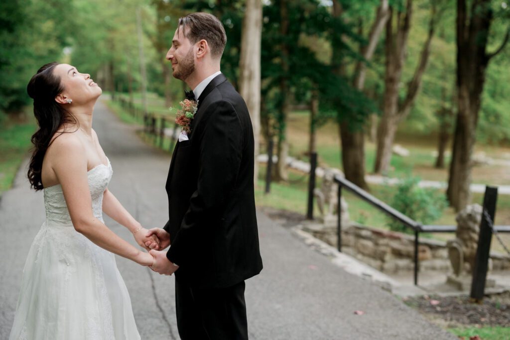 Vivian and Josh’s Gorgeous September Wedding at Arrow Park, NY
There’s something truly special about Arrow Park—it feels like my home away from home, and Vivian and Josh’s beautiful September wedding perfectly showcased everything this venue has to offer. Their blended celebration, honoring Vivian’s Korean heritage and Josh’s Jewish background, was a heartfelt and unforgettable day.
The couple beautifully wove their cultures into the festivities, from breaking the glass at the end of their garden ceremony to the lively horah during the reception. Later, Vivian and Josh delighted their guests by changing into traditional Korean hanbok outfits, a touching nod to her heritage.
Arrow Park: A Dream Venue for Multi-Day WeddingsVivian, Josh, and their loved ones all got ready at Arrow Park, which offers plenty of spacious accommodations for family and friends. This made it the perfect choice for their multi-day celebration. With its stunning grounds and versatile spaces, Arrow Park is ideal for couples seeking a wedding weekend filled with both elegance and comfort.
A Scenic September CelebrationThanks to the pleasant September weather, Vivian and Josh made full use of Arrow Park’s breathtaking grounds. Their day began with a magical first look along the iconic driveway lined with towering trees. From there, we explored the garden with its charming sculptures, captured moments by the ceremony’s floral décor, and took stunning portraits on the mansion’s iconic back staircase bathed in perfect lighting. We also ventured indoors for photos in the library and the Green Room, taking advantage of the mansion’s timeless charm.
As family and friends gathered, we captured formal portraits in front of the grand mansion before the ceremony began.
A Ceremony and Reception to RememberThe ceremony was set in the picturesque garden, where Jenny from Field Trip Flowers created a breathtaking floral backdrop that perfectly complemented the natural beauty of Arrow Park.
Afterward, guests strolled back to the mansion for a warm and inviting cocktail hour on the main floor. Later, everyone gathered in the courtyard for an enchanting outdoor reception under twinkling café lights. The space felt intimate yet grand, with the perfect blend of rustic elegance and romance.
Arrow Park’s charm, coupled with Vivian and Josh’s thoughtful cultural details, made this wedding one to remember. It’s the kind of venue where dreams come true—a hidden gem that’s ready to host your perfect day.
  
Thankful for all the wedding vendors that made this day possible:⁠
Venue: @arrowparkny
Floral: @fieldtripflowers
Catering: @lovenrosemary

Vivian and Josh Arrow Park NY Wedding documented by Karis from Hey Karis New York, Brooklyn, Hudson Valley NY and Catskills NY and NJ Wedding and NYC Elopement Photographer.