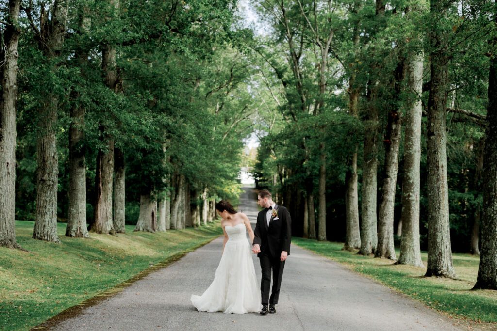 Vivian and Josh’s Gorgeous September Wedding at Arrow Park, NY
There’s something truly special about Arrow Park—it feels like my home away from home, and Vivian and Josh’s beautiful September wedding perfectly showcased everything this venue has to offer. Their blended celebration, honoring Vivian’s Korean heritage and Josh’s Jewish background, was a heartfelt and unforgettable day.
The couple beautifully wove their cultures into the festivities, from breaking the glass at the end of their garden ceremony to the lively horah during the reception. Later, Vivian and Josh delighted their guests by changing into traditional Korean hanbok outfits, a touching nod to her heritage.
Arrow Park: A Dream Venue for Multi-Day WeddingsVivian, Josh, and their loved ones all got ready at Arrow Park, which offers plenty of spacious accommodations for family and friends. This made it the perfect choice for their multi-day celebration. With its stunning grounds and versatile spaces, Arrow Park is ideal for couples seeking a wedding weekend filled with both elegance and comfort.
A Scenic September CelebrationThanks to the pleasant September weather, Vivian and Josh made full use of Arrow Park’s breathtaking grounds. Their day began with a magical first look along the iconic driveway lined with towering trees. From there, we explored the garden with its charming sculptures, captured moments by the ceremony’s floral décor, and took stunning portraits on the mansion’s iconic back staircase bathed in perfect lighting. We also ventured indoors for photos in the library and the Green Room, taking advantage of the mansion’s timeless charm.
As family and friends gathered, we captured formal portraits in front of the grand mansion before the ceremony began.
A Ceremony and Reception to RememberThe ceremony was set in the picturesque garden, where Jenny from Field Trip Flowers created a breathtaking floral backdrop that perfectly complemented the natural beauty of Arrow Park.
Afterward, guests strolled back to the mansion for a warm and inviting cocktail hour on the main floor. Later, everyone gathered in the courtyard for an enchanting outdoor reception under twinkling café lights. The space felt intimate yet grand, with the perfect blend of rustic elegance and romance.
Arrow Park’s charm, coupled with Vivian and Josh’s thoughtful cultural details, made this wedding one to remember. It’s the kind of venue where dreams come true—a hidden gem that’s ready to host your perfect day.
  
Thankful for all the wedding vendors that made this day possible:⁠
Venue: @arrowparkny
Floral: @fieldtripflowers
Catering: @lovenrosemary

Vivian and Josh Arrow Park NY Wedding documented by Karis from Hey Karis New York, Brooklyn, Hudson Valley NY and Catskills NY and NJ Wedding and NYC Elopement Photographer.
