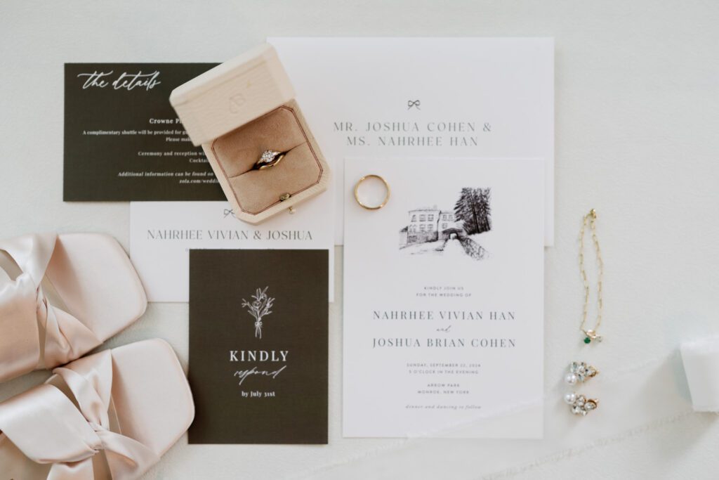 Vivian and Josh’s Gorgeous September Wedding at Arrow Park, NY
There’s something truly special about Arrow Park—it feels like my home away from home, and Vivian and Josh’s beautiful September wedding perfectly showcased everything this venue has to offer. Their blended celebration, honoring Vivian’s Korean heritage and Josh’s Jewish background, was a heartfelt and unforgettable day.
The couple beautifully wove their cultures into the festivities, from breaking the glass at the end of their garden ceremony to the lively horah during the reception. Later, Vivian and Josh delighted their guests by changing into traditional Korean hanbok outfits, a touching nod to her heritage.
Arrow Park: A Dream Venue for Multi-Day WeddingsVivian, Josh, and their loved ones all got ready at Arrow Park, which offers plenty of spacious accommodations for family and friends. This made it the perfect choice for their multi-day celebration. With its stunning grounds and versatile spaces, Arrow Park is ideal for couples seeking a wedding weekend filled with both elegance and comfort.
A Scenic September CelebrationThanks to the pleasant September weather, Vivian and Josh made full use of Arrow Park’s breathtaking grounds. Their day began with a magical first look along the iconic driveway lined with towering trees. From there, we explored the garden with its charming sculptures, captured moments by the ceremony’s floral décor, and took stunning portraits on the mansion’s iconic back staircase bathed in perfect lighting. We also ventured indoors for photos in the library and the Green Room, taking advantage of the mansion’s timeless charm.
As family and friends gathered, we captured formal portraits in front of the grand mansion before the ceremony began.
A Ceremony and Reception to RememberThe ceremony was set in the picturesque garden, where Jenny from Field Trip Flowers created a breathtaking floral backdrop that perfectly complemented the natural beauty of Arrow Park.
Afterward, guests strolled back to the mansion for a warm and inviting cocktail hour on the main floor. Later, everyone gathered in the courtyard for an enchanting outdoor reception under twinkling café lights. The space felt intimate yet grand, with the perfect blend of rustic elegance and romance.
Arrow Park’s charm, coupled with Vivian and Josh’s thoughtful cultural details, made this wedding one to remember. It’s the kind of venue where dreams come true—a hidden gem that’s ready to host your perfect day.
  
Thankful for all the wedding vendors that made this day possible:⁠
Venue: @arrowparkny
Floral: @fieldtripflowers
Catering: @lovenrosemary

Vivian and Josh Arrow Park NY Wedding documented by Karis from Hey Karis New York, Brooklyn, Hudson Valley NY and Catskills NY and NJ Wedding and NYC Elopement Photographer.