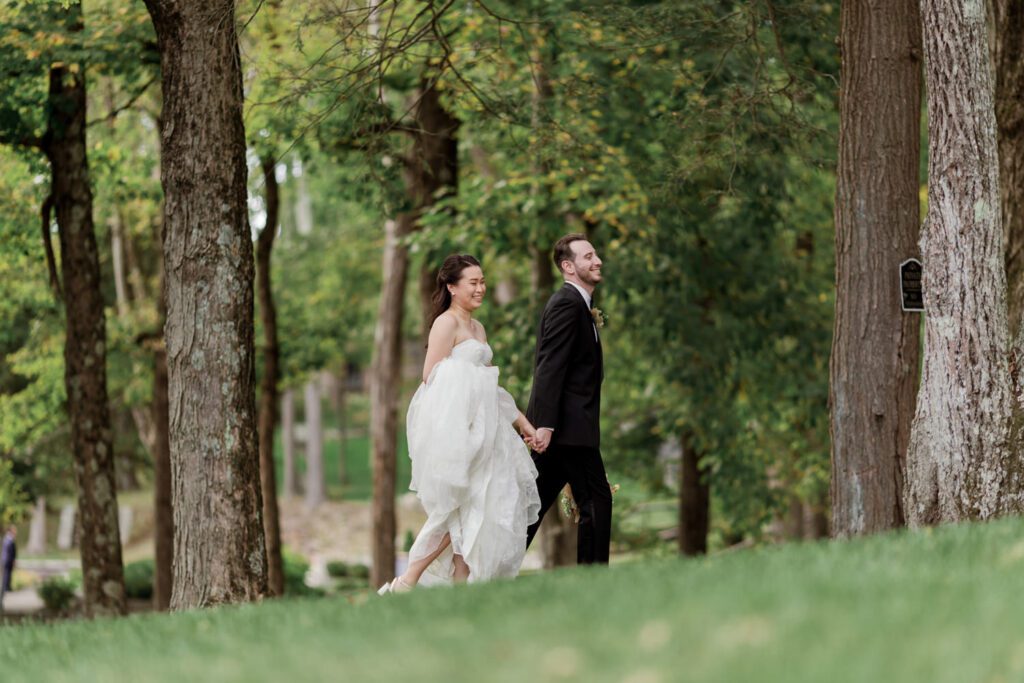 Vivian and Josh’s Gorgeous September Wedding at Arrow Park, NY
There’s something truly special about Arrow Park—it feels like my home away from home, and Vivian and Josh’s beautiful September wedding perfectly showcased everything this venue has to offer. Their blended celebration, honoring Vivian’s Korean heritage and Josh’s Jewish background, was a heartfelt and unforgettable day.
The couple beautifully wove their cultures into the festivities, from breaking the glass at the end of their garden ceremony to the lively horah during the reception. Later, Vivian and Josh delighted their guests by changing into traditional Korean hanbok outfits, a touching nod to her heritage.
Arrow Park: A Dream Venue for Multi-Day WeddingsVivian, Josh, and their loved ones all got ready at Arrow Park, which offers plenty of spacious accommodations for family and friends. This made it the perfect choice for their multi-day celebration. With its stunning grounds and versatile spaces, Arrow Park is ideal for couples seeking a wedding weekend filled with both elegance and comfort.
A Scenic September CelebrationThanks to the pleasant September weather, Vivian and Josh made full use of Arrow Park’s breathtaking grounds. Their day began with a magical first look along the iconic driveway lined with towering trees. From there, we explored the garden with its charming sculptures, captured moments by the ceremony’s floral décor, and took stunning portraits on the mansion’s iconic back staircase bathed in perfect lighting. We also ventured indoors for photos in the library and the Green Room, taking advantage of the mansion’s timeless charm.
As family and friends gathered, we captured formal portraits in front of the grand mansion before the ceremony began.
A Ceremony and Reception to RememberThe ceremony was set in the picturesque garden, where Jenny from Field Trip Flowers created a breathtaking floral backdrop that perfectly complemented the natural beauty of Arrow Park.
Afterward, guests strolled back to the mansion for a warm and inviting cocktail hour on the main floor. Later, everyone gathered in the courtyard for an enchanting outdoor reception under twinkling café lights. The space felt intimate yet grand, with the perfect blend of rustic elegance and romance.
Arrow Park’s charm, coupled with Vivian and Josh’s thoughtful cultural details, made this wedding one to remember. It’s the kind of venue where dreams come true—a hidden gem that’s ready to host your perfect day.
  
Thankful for all the wedding vendors that made this day possible:⁠
Venue: @arrowparkny
Floral: @fieldtripflowers
Catering: @lovenrosemary

Vivian and Josh Arrow Park NY Wedding documented by Karis from Hey Karis New York, Brooklyn, Hudson Valley NY and Catskills NY and NJ Wedding and NYC Elopement Photographer.