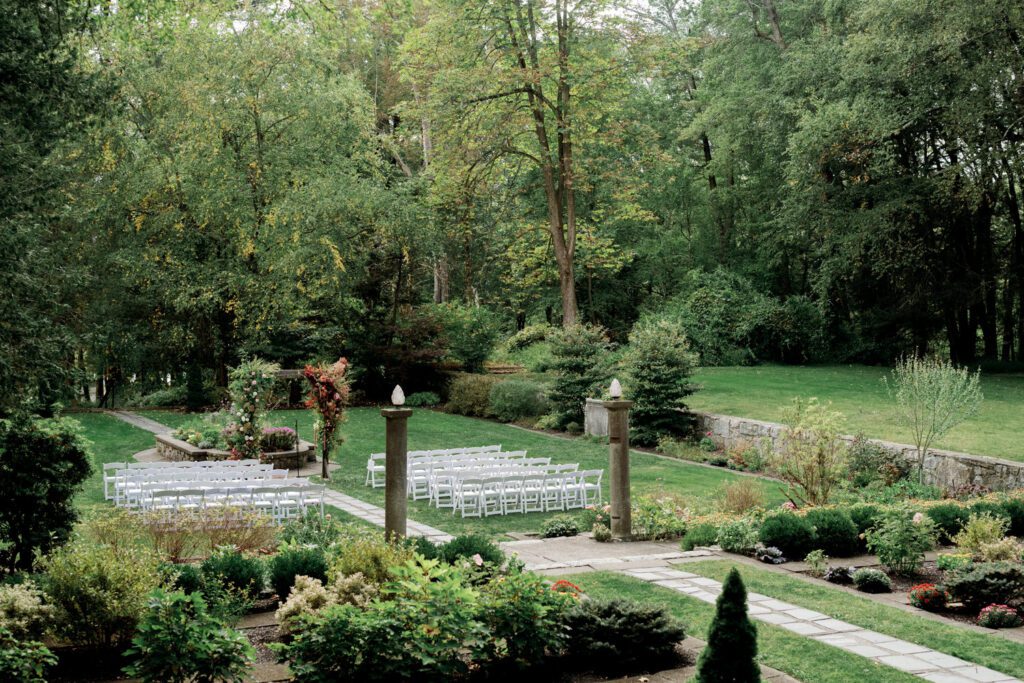 Vivian and Josh’s Gorgeous September Wedding at Arrow Park, NY
There’s something truly special about Arrow Park—it feels like my home away from home, and Vivian and Josh’s beautiful September wedding perfectly showcased everything this venue has to offer. Their blended celebration, honoring Vivian’s Korean heritage and Josh’s Jewish background, was a heartfelt and unforgettable day.
The couple beautifully wove their cultures into the festivities, from breaking the glass at the end of their garden ceremony to the lively horah during the reception. Later, Vivian and Josh delighted their guests by changing into traditional Korean hanbok outfits, a touching nod to her heritage.
Arrow Park: A Dream Venue for Multi-Day WeddingsVivian, Josh, and their loved ones all got ready at Arrow Park, which offers plenty of spacious accommodations for family and friends. This made it the perfect choice for their multi-day celebration. With its stunning grounds and versatile spaces, Arrow Park is ideal for couples seeking a wedding weekend filled with both elegance and comfort.
A Scenic September CelebrationThanks to the pleasant September weather, Vivian and Josh made full use of Arrow Park’s breathtaking grounds. Their day began with a magical first look along the iconic driveway lined with towering trees. From there, we explored the garden with its charming sculptures, captured moments by the ceremony’s floral décor, and took stunning portraits on the mansion’s iconic back staircase bathed in perfect lighting. We also ventured indoors for photos in the library and the Green Room, taking advantage of the mansion’s timeless charm.
As family and friends gathered, we captured formal portraits in front of the grand mansion before the ceremony began.
A Ceremony and Reception to RememberThe ceremony was set in the picturesque garden, where Jenny from Field Trip Flowers created a breathtaking floral backdrop that perfectly complemented the natural beauty of Arrow Park.
Afterward, guests strolled back to the mansion for a warm and inviting cocktail hour on the main floor. Later, everyone gathered in the courtyard for an enchanting outdoor reception under twinkling café lights. The space felt intimate yet grand, with the perfect blend of rustic elegance and romance.
Arrow Park’s charm, coupled with Vivian and Josh’s thoughtful cultural details, made this wedding one to remember. It’s the kind of venue where dreams come true—a hidden gem that’s ready to host your perfect day.
  
Thankful for all the wedding vendors that made this day possible:⁠
Venue: @arrowparkny
Floral: @fieldtripflowers
Catering: @lovenrosemary

Vivian and Josh Arrow Park NY Wedding documented by Karis from Hey Karis New York, Brooklyn, Hudson Valley NY and Catskills NY and NJ Wedding and NYC Elopement Photographer.