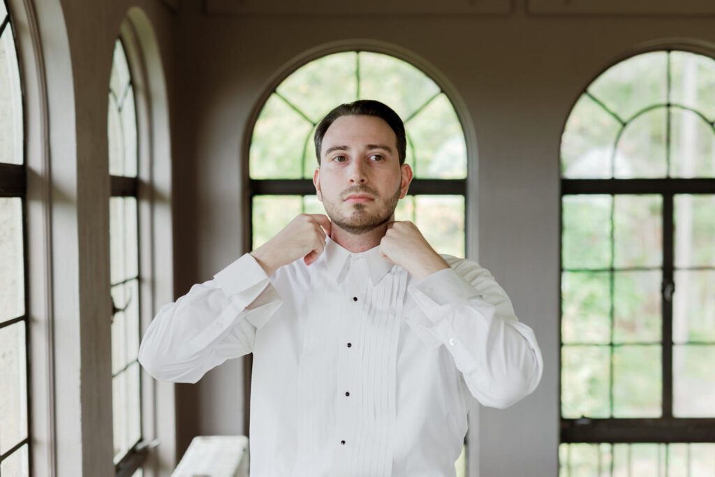 Vivian and Josh’s Gorgeous September Wedding at Arrow Park, NY
There’s something truly special about Arrow Park—it feels like my home away from home, and Vivian and Josh’s beautiful September wedding perfectly showcased everything this venue has to offer. Their blended celebration, honoring Vivian’s Korean heritage and Josh’s Jewish background, was a heartfelt and unforgettable day.
The couple beautifully wove their cultures into the festivities, from breaking the glass at the end of their garden ceremony to the lively horah during the reception. Later, Vivian and Josh delighted their guests by changing into traditional Korean hanbok outfits, a touching nod to her heritage.
Arrow Park: A Dream Venue for Multi-Day WeddingsVivian, Josh, and their loved ones all got ready at Arrow Park, which offers plenty of spacious accommodations for family and friends. This made it the perfect choice for their multi-day celebration. With its stunning grounds and versatile spaces, Arrow Park is ideal for couples seeking a wedding weekend filled with both elegance and comfort.
A Scenic September CelebrationThanks to the pleasant September weather, Vivian and Josh made full use of Arrow Park’s breathtaking grounds. Their day began with a magical first look along the iconic driveway lined with towering trees. From there, we explored the garden with its charming sculptures, captured moments by the ceremony’s floral décor, and took stunning portraits on the mansion’s iconic back staircase bathed in perfect lighting. We also ventured indoors for photos in the library and the Green Room, taking advantage of the mansion’s timeless charm.
As family and friends gathered, we captured formal portraits in front of the grand mansion before the ceremony began.
A Ceremony and Reception to RememberThe ceremony was set in the picturesque garden, where Jenny from Field Trip Flowers created a breathtaking floral backdrop that perfectly complemented the natural beauty of Arrow Park.
Afterward, guests strolled back to the mansion for a warm and inviting cocktail hour on the main floor. Later, everyone gathered in the courtyard for an enchanting outdoor reception under twinkling café lights. The space felt intimate yet grand, with the perfect blend of rustic elegance and romance.
Arrow Park’s charm, coupled with Vivian and Josh’s thoughtful cultural details, made this wedding one to remember. It’s the kind of venue where dreams come true—a hidden gem that’s ready to host your perfect day.
  
Thankful for all the wedding vendors that made this day possible:⁠
Venue: @arrowparkny
Floral: @fieldtripflowers
Catering: @lovenrosemary

Vivian and Josh Arrow Park NY Wedding documented by Karis from Hey Karis New York, Brooklyn, Hudson Valley NY and Catskills NY and NJ Wedding and NYC Elopement Photographer.