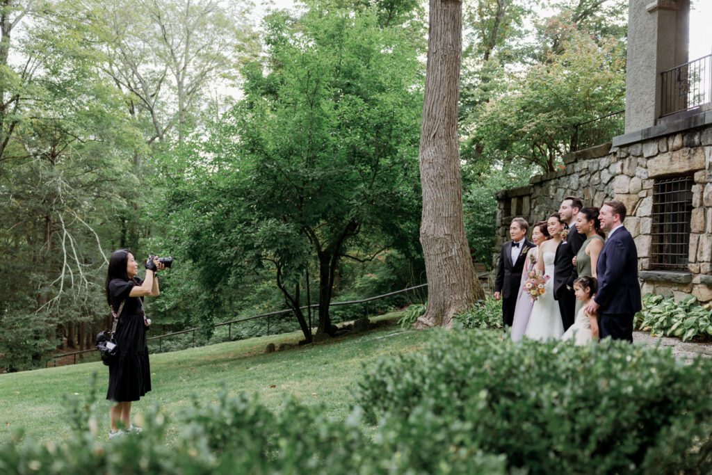 Vivian and Josh’s Gorgeous September Wedding at Arrow Park, NY
There’s something truly special about Arrow Park—it feels like my home away from home, and Vivian and Josh’s beautiful September wedding perfectly showcased everything this venue has to offer. Their blended celebration, honoring Vivian’s Korean heritage and Josh’s Jewish background, was a heartfelt and unforgettable day.
The couple beautifully wove their cultures into the festivities, from breaking the glass at the end of their garden ceremony to the lively horah during the reception. Later, Vivian and Josh delighted their guests by changing into traditional Korean hanbok outfits, a touching nod to her heritage.
Arrow Park: A Dream Venue for Multi-Day WeddingsVivian, Josh, and their loved ones all got ready at Arrow Park, which offers plenty of spacious accommodations for family and friends. This made it the perfect choice for their multi-day celebration. With its stunning grounds and versatile spaces, Arrow Park is ideal for couples seeking a wedding weekend filled with both elegance and comfort.
A Scenic September CelebrationThanks to the pleasant September weather, Vivian and Josh made full use of Arrow Park’s breathtaking grounds. Their day began with a magical first look along the iconic driveway lined with towering trees. From there, we explored the garden with its charming sculptures, captured moments by the ceremony’s floral décor, and took stunning portraits on the mansion’s iconic back staircase bathed in perfect lighting. We also ventured indoors for photos in the library and the Green Room, taking advantage of the mansion’s timeless charm.
As family and friends gathered, we captured formal portraits in front of the grand mansion before the ceremony began.
A Ceremony and Reception to RememberThe ceremony was set in the picturesque garden, where Jenny from Field Trip Flowers created a breathtaking floral backdrop that perfectly complemented the natural beauty of Arrow Park.
Afterward, guests strolled back to the mansion for a warm and inviting cocktail hour on the main floor. Later, everyone gathered in the courtyard for an enchanting outdoor reception under twinkling café lights. The space felt intimate yet grand, with the perfect blend of rustic elegance and romance.
Arrow Park’s charm, coupled with Vivian and Josh’s thoughtful cultural details, made this wedding one to remember. It’s the kind of venue where dreams come true—a hidden gem that’s ready to host your perfect day.
  
Thankful for all the wedding vendors that made this day possible:⁠
Venue: @arrowparkny
Floral: @fieldtripflowers
Catering: @lovenrosemary

Vivian and Josh Arrow Park NY Wedding documented by Karis from Hey Karis New York, Brooklyn, Hudson Valley NY and Catskills NY and NJ Wedding and NYC Elopement Photographer.