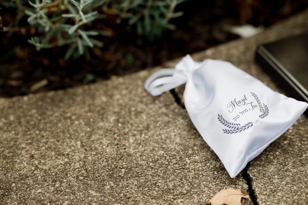 Vivian and Josh’s Gorgeous September Wedding at Arrow Park, NY
There’s something truly special about Arrow Park—it feels like my home away from home, and Vivian and Josh’s beautiful September wedding perfectly showcased everything this venue has to offer. Their blended celebration, honoring Vivian’s Korean heritage and Josh’s Jewish background, was a heartfelt and unforgettable day.
The couple beautifully wove their cultures into the festivities, from breaking the glass at the end of their garden ceremony to the lively horah during the reception. Later, Vivian and Josh delighted their guests by changing into traditional Korean hanbok outfits, a touching nod to her heritage.
Arrow Park: A Dream Venue for Multi-Day WeddingsVivian, Josh, and their loved ones all got ready at Arrow Park, which offers plenty of spacious accommodations for family and friends. This made it the perfect choice for their multi-day celebration. With its stunning grounds and versatile spaces, Arrow Park is ideal for couples seeking a wedding weekend filled with both elegance and comfort.
A Scenic September CelebrationThanks to the pleasant September weather, Vivian and Josh made full use of Arrow Park’s breathtaking grounds. Their day began with a magical first look along the iconic driveway lined with towering trees. From there, we explored the garden with its charming sculptures, captured moments by the ceremony’s floral décor, and took stunning portraits on the mansion’s iconic back staircase bathed in perfect lighting. We also ventured indoors for photos in the library and the Green Room, taking advantage of the mansion’s timeless charm.
As family and friends gathered, we captured formal portraits in front of the grand mansion before the ceremony began.
A Ceremony and Reception to RememberThe ceremony was set in the picturesque garden, where Jenny from Field Trip Flowers created a breathtaking floral backdrop that perfectly complemented the natural beauty of Arrow Park.
Afterward, guests strolled back to the mansion for a warm and inviting cocktail hour on the main floor. Later, everyone gathered in the courtyard for an enchanting outdoor reception under twinkling café lights. The space felt intimate yet grand, with the perfect blend of rustic elegance and romance.
Arrow Park’s charm, coupled with Vivian and Josh’s thoughtful cultural details, made this wedding one to remember. It’s the kind of venue where dreams come true—a hidden gem that’s ready to host your perfect day.
  
Thankful for all the wedding vendors that made this day possible:⁠
Venue: @arrowparkny
Floral: @fieldtripflowers
Catering: @lovenrosemary

Vivian and Josh Arrow Park NY Wedding documented by Karis from Hey Karis New York, Brooklyn, Hudson Valley NY and Catskills NY and NJ Wedding and NYC Elopement Photographer.