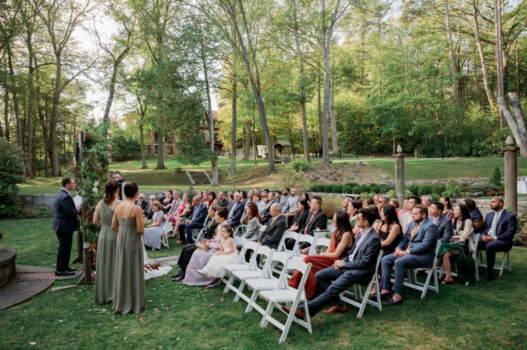 Vivian and Josh’s Gorgeous September Wedding at Arrow Park, NY
There’s something truly special about Arrow Park—it feels like my home away from home, and Vivian and Josh’s beautiful September wedding perfectly showcased everything this venue has to offer. Their blended celebration, honoring Vivian’s Korean heritage and Josh’s Jewish background, was a heartfelt and unforgettable day.
The couple beautifully wove their cultures into the festivities, from breaking the glass at the end of their garden ceremony to the lively horah during the reception. Later, Vivian and Josh delighted their guests by changing into traditional Korean hanbok outfits, a touching nod to her heritage.
Arrow Park: A Dream Venue for Multi-Day WeddingsVivian, Josh, and their loved ones all got ready at Arrow Park, which offers plenty of spacious accommodations for family and friends. This made it the perfect choice for their multi-day celebration. With its stunning grounds and versatile spaces, Arrow Park is ideal for couples seeking a wedding weekend filled with both elegance and comfort.
A Scenic September CelebrationThanks to the pleasant September weather, Vivian and Josh made full use of Arrow Park’s breathtaking grounds. Their day began with a magical first look along the iconic driveway lined with towering trees. From there, we explored the garden with its charming sculptures, captured moments by the ceremony’s floral décor, and took stunning portraits on the mansion’s iconic back staircase bathed in perfect lighting. We also ventured indoors for photos in the library and the Green Room, taking advantage of the mansion’s timeless charm.
As family and friends gathered, we captured formal portraits in front of the grand mansion before the ceremony began.
A Ceremony and Reception to RememberThe ceremony was set in the picturesque garden, where Jenny from Field Trip Flowers created a breathtaking floral backdrop that perfectly complemented the natural beauty of Arrow Park.
Afterward, guests strolled back to the mansion for a warm and inviting cocktail hour on the main floor. Later, everyone gathered in the courtyard for an enchanting outdoor reception under twinkling café lights. The space felt intimate yet grand, with the perfect blend of rustic elegance and romance.
Arrow Park’s charm, coupled with Vivian and Josh’s thoughtful cultural details, made this wedding one to remember. It’s the kind of venue where dreams come true—a hidden gem that’s ready to host your perfect day.
  
Thankful for all the wedding vendors that made this day possible:⁠
Venue: @arrowparkny
Floral: @fieldtripflowers
Catering: @lovenrosemary

Vivian and Josh Arrow Park NY Wedding documented by Karis from Hey Karis New York, Brooklyn, Hudson Valley NY and Catskills NY and NJ Wedding and NYC Elopement Photographer.