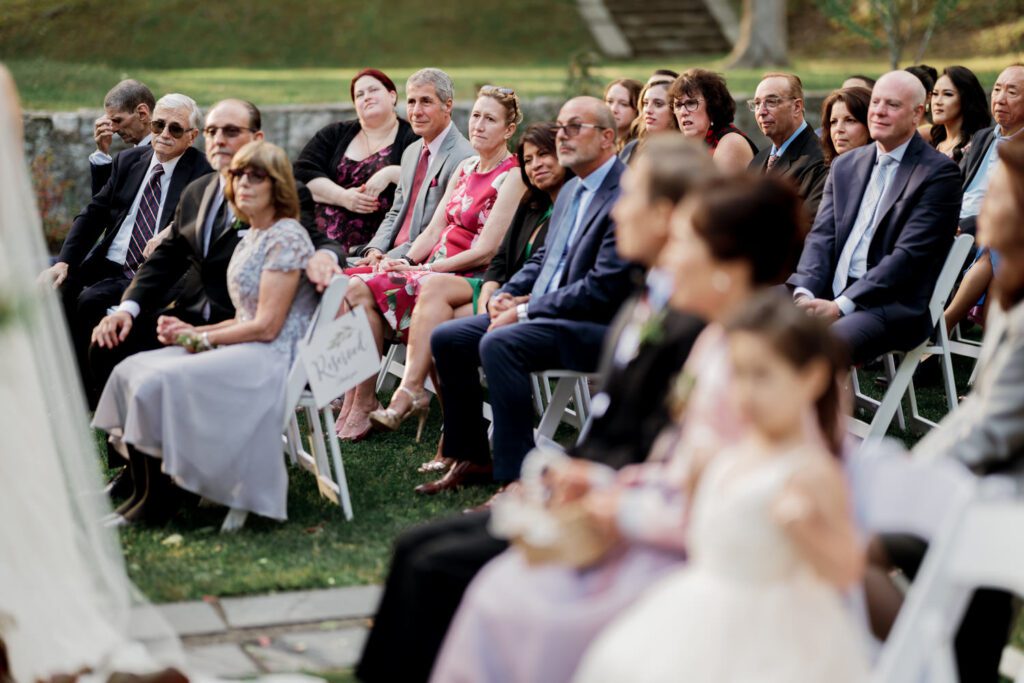 Vivian and Josh’s Gorgeous September Wedding at Arrow Park, NY
There’s something truly special about Arrow Park—it feels like my home away from home, and Vivian and Josh’s beautiful September wedding perfectly showcased everything this venue has to offer. Their blended celebration, honoring Vivian’s Korean heritage and Josh’s Jewish background, was a heartfelt and unforgettable day.
The couple beautifully wove their cultures into the festivities, from breaking the glass at the end of their garden ceremony to the lively horah during the reception. Later, Vivian and Josh delighted their guests by changing into traditional Korean hanbok outfits, a touching nod to her heritage.
Arrow Park: A Dream Venue for Multi-Day WeddingsVivian, Josh, and their loved ones all got ready at Arrow Park, which offers plenty of spacious accommodations for family and friends. This made it the perfect choice for their multi-day celebration. With its stunning grounds and versatile spaces, Arrow Park is ideal for couples seeking a wedding weekend filled with both elegance and comfort.
A Scenic September CelebrationThanks to the pleasant September weather, Vivian and Josh made full use of Arrow Park’s breathtaking grounds. Their day began with a magical first look along the iconic driveway lined with towering trees. From there, we explored the garden with its charming sculptures, captured moments by the ceremony’s floral décor, and took stunning portraits on the mansion’s iconic back staircase bathed in perfect lighting. We also ventured indoors for photos in the library and the Green Room, taking advantage of the mansion’s timeless charm.
As family and friends gathered, we captured formal portraits in front of the grand mansion before the ceremony began.
A Ceremony and Reception to RememberThe ceremony was set in the picturesque garden, where Jenny from Field Trip Flowers created a breathtaking floral backdrop that perfectly complemented the natural beauty of Arrow Park.
Afterward, guests strolled back to the mansion for a warm and inviting cocktail hour on the main floor. Later, everyone gathered in the courtyard for an enchanting outdoor reception under twinkling café lights. The space felt intimate yet grand, with the perfect blend of rustic elegance and romance.
Arrow Park’s charm, coupled with Vivian and Josh’s thoughtful cultural details, made this wedding one to remember. It’s the kind of venue where dreams come true—a hidden gem that’s ready to host your perfect day.
  
Thankful for all the wedding vendors that made this day possible:⁠
Venue: @arrowparkny
Floral: @fieldtripflowers
Catering: @lovenrosemary

Vivian and Josh Arrow Park NY Wedding documented by Karis from Hey Karis New York, Brooklyn, Hudson Valley NY and Catskills NY and NJ Wedding and NYC Elopement Photographer.
