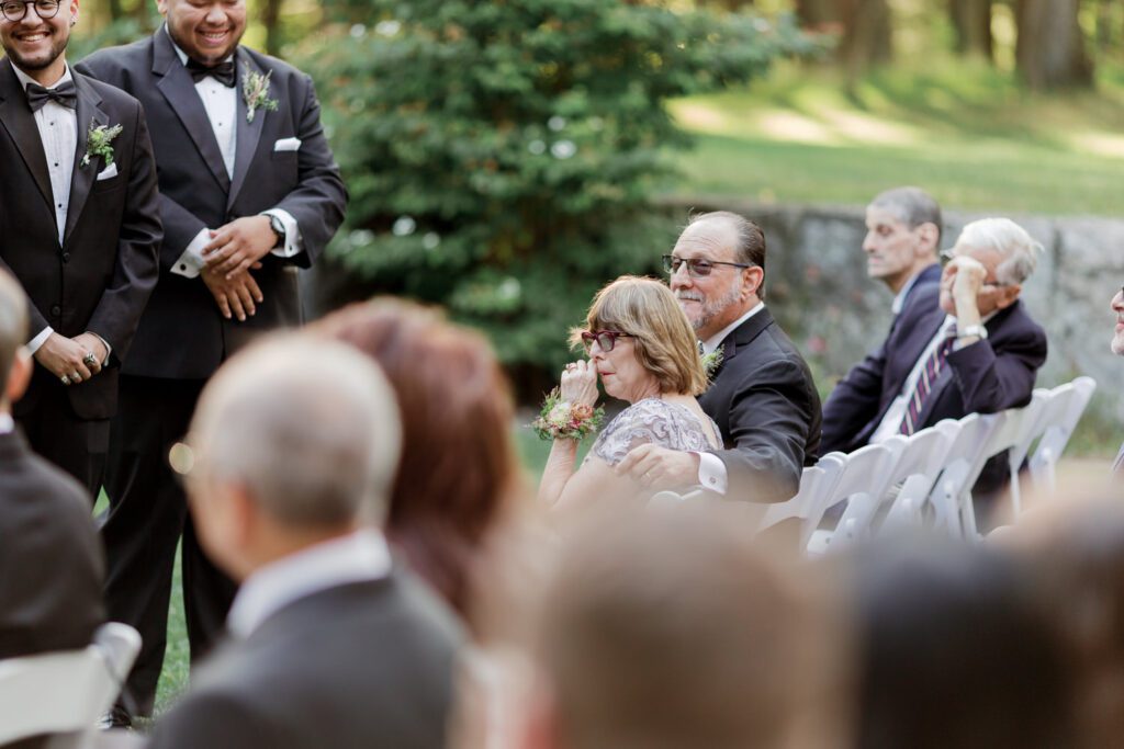 Vivian and Josh’s Gorgeous September Wedding at Arrow Park, NY
There’s something truly special about Arrow Park—it feels like my home away from home, and Vivian and Josh’s beautiful September wedding perfectly showcased everything this venue has to offer. Their blended celebration, honoring Vivian’s Korean heritage and Josh’s Jewish background, was a heartfelt and unforgettable day.
The couple beautifully wove their cultures into the festivities, from breaking the glass at the end of their garden ceremony to the lively horah during the reception. Later, Vivian and Josh delighted their guests by changing into traditional Korean hanbok outfits, a touching nod to her heritage.
Arrow Park: A Dream Venue for Multi-Day WeddingsVivian, Josh, and their loved ones all got ready at Arrow Park, which offers plenty of spacious accommodations for family and friends. This made it the perfect choice for their multi-day celebration. With its stunning grounds and versatile spaces, Arrow Park is ideal for couples seeking a wedding weekend filled with both elegance and comfort.
A Scenic September CelebrationThanks to the pleasant September weather, Vivian and Josh made full use of Arrow Park’s breathtaking grounds. Their day began with a magical first look along the iconic driveway lined with towering trees. From there, we explored the garden with its charming sculptures, captured moments by the ceremony’s floral décor, and took stunning portraits on the mansion’s iconic back staircase bathed in perfect lighting. We also ventured indoors for photos in the library and the Green Room, taking advantage of the mansion’s timeless charm.
As family and friends gathered, we captured formal portraits in front of the grand mansion before the ceremony began.
A Ceremony and Reception to RememberThe ceremony was set in the picturesque garden, where Jenny from Field Trip Flowers created a breathtaking floral backdrop that perfectly complemented the natural beauty of Arrow Park.
Afterward, guests strolled back to the mansion for a warm and inviting cocktail hour on the main floor. Later, everyone gathered in the courtyard for an enchanting outdoor reception under twinkling café lights. The space felt intimate yet grand, with the perfect blend of rustic elegance and romance.
Arrow Park’s charm, coupled with Vivian and Josh’s thoughtful cultural details, made this wedding one to remember. It’s the kind of venue where dreams come true—a hidden gem that’s ready to host your perfect day.
  
Thankful for all the wedding vendors that made this day possible:⁠
Venue: @arrowparkny
Floral: @fieldtripflowers
Catering: @lovenrosemary

Vivian and Josh Arrow Park NY Wedding documented by Karis from Hey Karis New York, Brooklyn, Hudson Valley NY and Catskills NY and NJ Wedding and NYC Elopement Photographer.