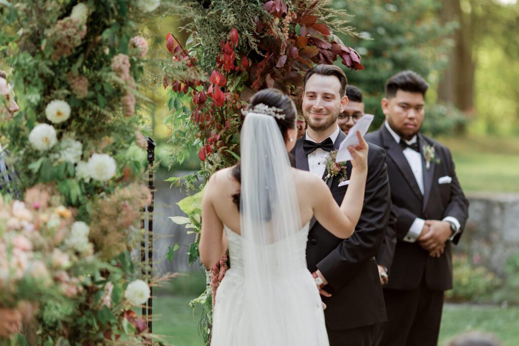 Vivian and Josh’s Gorgeous September Wedding at Arrow Park, NY
There’s something truly special about Arrow Park—it feels like my home away from home, and Vivian and Josh’s beautiful September wedding perfectly showcased everything this venue has to offer. Their blended celebration, honoring Vivian’s Korean heritage and Josh’s Jewish background, was a heartfelt and unforgettable day.
The couple beautifully wove their cultures into the festivities, from breaking the glass at the end of their garden ceremony to the lively horah during the reception. Later, Vivian and Josh delighted their guests by changing into traditional Korean hanbok outfits, a touching nod to her heritage.
Arrow Park: A Dream Venue for Multi-Day WeddingsVivian, Josh, and their loved ones all got ready at Arrow Park, which offers plenty of spacious accommodations for family and friends. This made it the perfect choice for their multi-day celebration. With its stunning grounds and versatile spaces, Arrow Park is ideal for couples seeking a wedding weekend filled with both elegance and comfort.
A Scenic September CelebrationThanks to the pleasant September weather, Vivian and Josh made full use of Arrow Park’s breathtaking grounds. Their day began with a magical first look along the iconic driveway lined with towering trees. From there, we explored the garden with its charming sculptures, captured moments by the ceremony’s floral décor, and took stunning portraits on the mansion’s iconic back staircase bathed in perfect lighting. We also ventured indoors for photos in the library and the Green Room, taking advantage of the mansion’s timeless charm.
As family and friends gathered, we captured formal portraits in front of the grand mansion before the ceremony began.
A Ceremony and Reception to RememberThe ceremony was set in the picturesque garden, where Jenny from Field Trip Flowers created a breathtaking floral backdrop that perfectly complemented the natural beauty of Arrow Park.
Afterward, guests strolled back to the mansion for a warm and inviting cocktail hour on the main floor. Later, everyone gathered in the courtyard for an enchanting outdoor reception under twinkling café lights. The space felt intimate yet grand, with the perfect blend of rustic elegance and romance.
Arrow Park’s charm, coupled with Vivian and Josh’s thoughtful cultural details, made this wedding one to remember. It’s the kind of venue where dreams come true—a hidden gem that’s ready to host your perfect day.
  
Thankful for all the wedding vendors that made this day possible:⁠
Venue: @arrowparkny
Floral: @fieldtripflowers
Catering: @lovenrosemary

Vivian and Josh Arrow Park NY Wedding documented by Karis from Hey Karis New York, Brooklyn, Hudson Valley NY and Catskills NY and NJ Wedding and NYC Elopement Photographer.