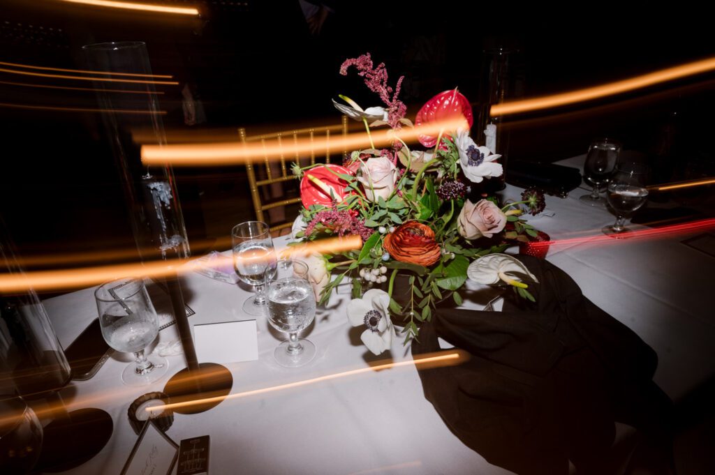 Kirsten and AJ’s September Wedding at Arrow Park, NY
Kirsten and AJ’s wedding day was a bit chilly and rainy, but their flexibility and positivity turned the day into a magical celebration. Originally planned for the garden, the ceremony was moved indoors due to the autumn rain. The staff at Arrow Park seamlessly transitioned the setup to the mansion’s main floor, creating an intimate and elegant ceremony space. The historic charm of the mansion, with its grand details and warm ambiance, added a cozy, romantic touch to their special day.
Kirsten, a talented fashion designer, surprised everyone—including her groom, AJ—by wearing a stunning black velvet strapless dress with an oversized white bow draping dramatically down the back. She designed the dress herself, and it was a show-stopper that perfectly reflected her unique style. The ceremony was heartfelt and personal, with family and friends gathering close to witness Kirsten and AJ’s vows.
After the ceremony, the main mansion was transformed to host a lively cocktail hour. Guests mingled and enjoyed delicious hors d'oeuvres while the reception space in the pavilion was being prepared. Kirsten and AJ’s attention to detail shone through in their décor choices, including the black-and-white checkered flooring that gave the pavilion a retro vibe. It was a perfect blend of modern chic and classic sophistication.
The reception began with Kirsten and AJ’s grand entrance, greeted by cheers from their guests. Their first dance was sweet and endearing, setting the tone for a night of joy and celebration. As the evening progressed, the party ramped up with enthusiastic dancing, heartfelt toasts, and even a surprise performance—a few uncles took the mic for an impromptu rap song that brought the house down.
Arrow Park provided the perfect backdrop for Kirsten and AJ’s wedding. With its blend of natural beauty and historic architecture, it’s an ideal venue for couples seeking a mix of indoor and outdoor spaces. The mansion offers a timeless elegance, while the pavilion provides a versatile setting for larger receptions.
Planning Tips for Future Couples at Arrow Park:
1. Have a Rain Plan: September weather can be unpredictable, so work with the Arrow Park staff to plan for both indoor and outdoor options. The mansion’s interiors provide a stunning alternative for ceremonies or cocktail hours.
2. Maximize the Pavilion: The pavilion’s spacious layout can accommodate various themes and setups. Consider unique flooring, lighting, or drapery to make the space your own.
3. Embrace the Venue’s Charm: Use the mansion’s historic features—like the fireplaces and vintage decor—as part of your wedding aesthetic. It’s a built-in backdrop that needs little embellishment.
4. Plan Time for Photos: Arrow Park’s grounds are breathtaking, especially in the fall. Schedule time with your photographer to capture the beauty of the lake, gardens, and mansion.
Kirsten and AJ’s wedding was a true testament to the power of creativity, adaptability, and love. Their celebration at Arrow Park was unforgettable, and I’m grateful to have been a part of their special day.
Thankful for all the wedding vendors that made this day possible:⁠
Venue: @arrowparkny
Catering: @lovenrosemary
Kirsten and AJ Arrow Park NY Wedding documented by Karis from Hey Karis New York, Brooklyn, Hudson Valley NY and Catskills NY and NJ Wedding and NYC Elopement Photographer.