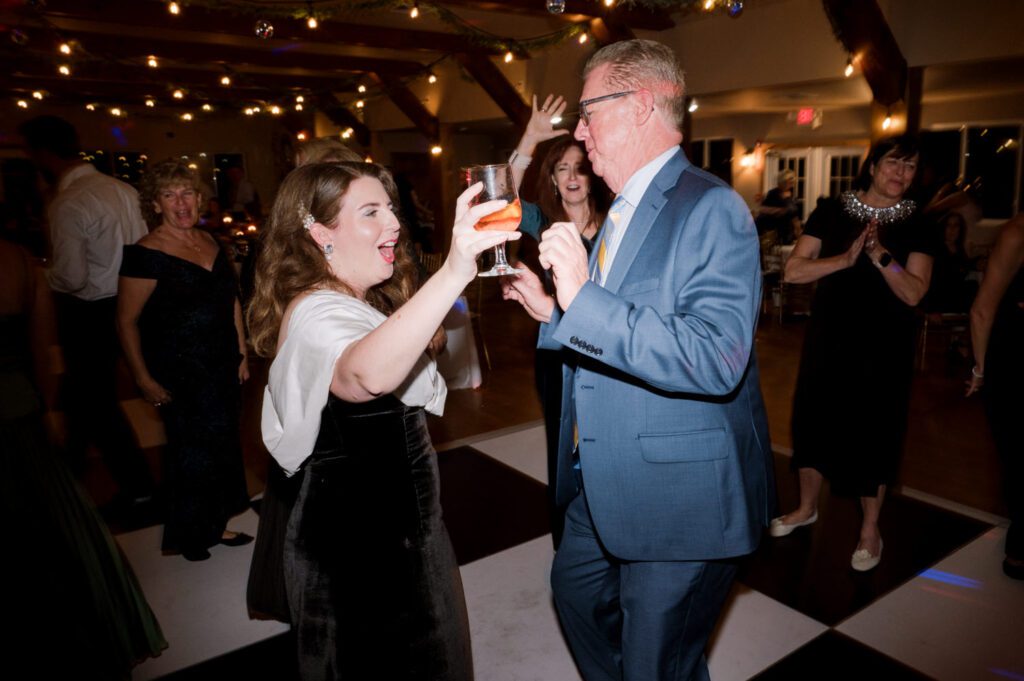 Kirsten and AJ’s September Wedding at Arrow Park, NY
Kirsten and AJ’s wedding day was a bit chilly and rainy, but their flexibility and positivity turned the day into a magical celebration. Originally planned for the garden, the ceremony was moved indoors due to the autumn rain. The staff at Arrow Park seamlessly transitioned the setup to the mansion’s main floor, creating an intimate and elegant ceremony space. The historic charm of the mansion, with its grand details and warm ambiance, added a cozy, romantic touch to their special day.
Kirsten, a talented fashion designer, surprised everyone—including her groom, AJ—by wearing a stunning black velvet strapless dress with an oversized white bow draping dramatically down the back. She designed the dress herself, and it was a show-stopper that perfectly reflected her unique style. The ceremony was heartfelt and personal, with family and friends gathering close to witness Kirsten and AJ’s vows.
After the ceremony, the main mansion was transformed to host a lively cocktail hour. Guests mingled and enjoyed delicious hors d'oeuvres while the reception space in the pavilion was being prepared. Kirsten and AJ’s attention to detail shone through in their décor choices, including the black-and-white checkered flooring that gave the pavilion a retro vibe. It was a perfect blend of modern chic and classic sophistication.
The reception began with Kirsten and AJ’s grand entrance, greeted by cheers from their guests. Their first dance was sweet and endearing, setting the tone for a night of joy and celebration. As the evening progressed, the party ramped up with enthusiastic dancing, heartfelt toasts, and even a surprise performance—a few uncles took the mic for an impromptu rap song that brought the house down.
Arrow Park provided the perfect backdrop for Kirsten and AJ’s wedding. With its blend of natural beauty and historic architecture, it’s an ideal venue for couples seeking a mix of indoor and outdoor spaces. The mansion offers a timeless elegance, while the pavilion provides a versatile setting for larger receptions.
Planning Tips for Future Couples at Arrow Park:
1. Have a Rain Plan: September weather can be unpredictable, so work with the Arrow Park staff to plan for both indoor and outdoor options. The mansion’s interiors provide a stunning alternative for ceremonies or cocktail hours.
2. Maximize the Pavilion: The pavilion’s spacious layout can accommodate various themes and setups. Consider unique flooring, lighting, or drapery to make the space your own.
3. Embrace the Venue’s Charm: Use the mansion’s historic features—like the fireplaces and vintage decor—as part of your wedding aesthetic. It’s a built-in backdrop that needs little embellishment.
4. Plan Time for Photos: Arrow Park’s grounds are breathtaking, especially in the fall. Schedule time with your photographer to capture the beauty of the lake, gardens, and mansion.
Kirsten and AJ’s wedding was a true testament to the power of creativity, adaptability, and love. Their celebration at Arrow Park was unforgettable, and I’m grateful to have been a part of their special day.
Thankful for all the wedding vendors that made this day possible:⁠
Venue: @arrowparkny
Catering: @lovenrosemary
Kirsten and AJ Arrow Park NY Wedding documented by Karis from Hey Karis New York, Brooklyn, Hudson Valley NY and Catskills NY and NJ Wedding and NYC Elopement Photographer.