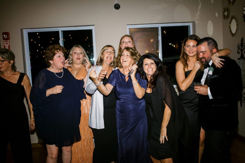 Kirsten and AJ’s September Wedding at Arrow Park, NY
Kirsten and AJ’s wedding day was a bit chilly and rainy, but their flexibility and positivity turned the day into a magical celebration. Originally planned for the garden, the ceremony was moved indoors due to the autumn rain. The staff at Arrow Park seamlessly transitioned the setup to the mansion’s main floor, creating an intimate and elegant ceremony space. The historic charm of the mansion, with its grand details and warm ambiance, added a cozy, romantic touch to their special day.
Kirsten, a talented fashion designer, surprised everyone—including her groom, AJ—by wearing a stunning black velvet strapless dress with an oversized white bow draping dramatically down the back. She designed the dress herself, and it was a show-stopper that perfectly reflected her unique style. The ceremony was heartfelt and personal, with family and friends gathering close to witness Kirsten and AJ’s vows.
After the ceremony, the main mansion was transformed to host a lively cocktail hour. Guests mingled and enjoyed delicious hors d'oeuvres while the reception space in the pavilion was being prepared. Kirsten and AJ’s attention to detail shone through in their décor choices, including the black-and-white checkered flooring that gave the pavilion a retro vibe. It was a perfect blend of modern chic and classic sophistication.
The reception began with Kirsten and AJ’s grand entrance, greeted by cheers from their guests. Their first dance was sweet and endearing, setting the tone for a night of joy and celebration. As the evening progressed, the party ramped up with enthusiastic dancing, heartfelt toasts, and even a surprise performance—a few uncles took the mic for an impromptu rap song that brought the house down.
Arrow Park provided the perfect backdrop for Kirsten and AJ’s wedding. With its blend of natural beauty and historic architecture, it’s an ideal venue for couples seeking a mix of indoor and outdoor spaces. The mansion offers a timeless elegance, while the pavilion provides a versatile setting for larger receptions.
Planning Tips for Future Couples at Arrow Park:
1. Have a Rain Plan: September weather can be unpredictable, so work with the Arrow Park staff to plan for both indoor and outdoor options. The mansion’s interiors provide a stunning alternative for ceremonies or cocktail hours.
2. Maximize the Pavilion: The pavilion’s spacious layout can accommodate various themes and setups. Consider unique flooring, lighting, or drapery to make the space your own.
3. Embrace the Venue’s Charm: Use the mansion’s historic features—like the fireplaces and vintage decor—as part of your wedding aesthetic. It’s a built-in backdrop that needs little embellishment.
4. Plan Time for Photos: Arrow Park’s grounds are breathtaking, especially in the fall. Schedule time with your photographer to capture the beauty of the lake, gardens, and mansion.
Kirsten and AJ’s wedding was a true testament to the power of creativity, adaptability, and love. Their celebration at Arrow Park was unforgettable, and I’m grateful to have been a part of their special day.
Thankful for all the wedding vendors that made this day possible:⁠
Venue: @arrowparkny
Catering: @lovenrosemary
Kirsten and AJ Arrow Park NY Wedding documented by Karis from Hey Karis New York, Brooklyn, Hudson Valley NY and Catskills NY and NJ Wedding and NYC Elopement Photographer.