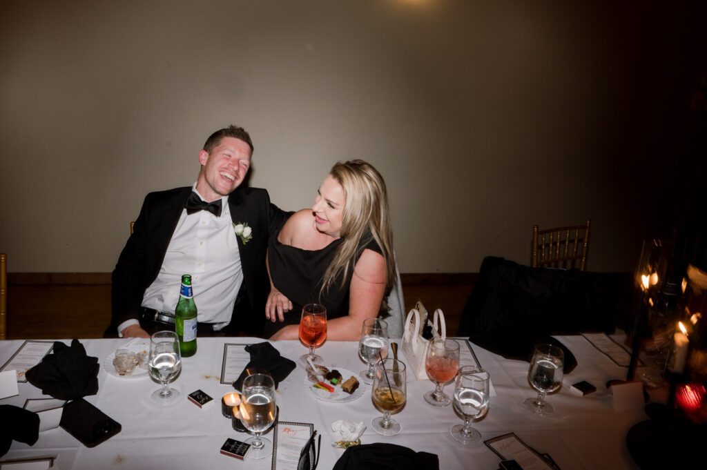 Kirsten and AJ’s September Wedding at Arrow Park, NY
Kirsten and AJ’s wedding day was a bit chilly and rainy, but their flexibility and positivity turned the day into a magical celebration. Originally planned for the garden, the ceremony was moved indoors due to the autumn rain. The staff at Arrow Park seamlessly transitioned the setup to the mansion’s main floor, creating an intimate and elegant ceremony space. The historic charm of the mansion, with its grand details and warm ambiance, added a cozy, romantic touch to their special day.
Kirsten, a talented fashion designer, surprised everyone—including her groom, AJ—by wearing a stunning black velvet strapless dress with an oversized white bow draping dramatically down the back. She designed the dress herself, and it was a show-stopper that perfectly reflected her unique style. The ceremony was heartfelt and personal, with family and friends gathering close to witness Kirsten and AJ’s vows.
After the ceremony, the main mansion was transformed to host a lively cocktail hour. Guests mingled and enjoyed delicious hors d'oeuvres while the reception space in the pavilion was being prepared. Kirsten and AJ’s attention to detail shone through in their décor choices, including the black-and-white checkered flooring that gave the pavilion a retro vibe. It was a perfect blend of modern chic and classic sophistication.
The reception began with Kirsten and AJ’s grand entrance, greeted by cheers from their guests. Their first dance was sweet and endearing, setting the tone for a night of joy and celebration. As the evening progressed, the party ramped up with enthusiastic dancing, heartfelt toasts, and even a surprise performance—a few uncles took the mic for an impromptu rap song that brought the house down.
Arrow Park provided the perfect backdrop for Kirsten and AJ’s wedding. With its blend of natural beauty and historic architecture, it’s an ideal venue for couples seeking a mix of indoor and outdoor spaces. The mansion offers a timeless elegance, while the pavilion provides a versatile setting for larger receptions.
Planning Tips for Future Couples at Arrow Park:
1. Have a Rain Plan: September weather can be unpredictable, so work with the Arrow Park staff to plan for both indoor and outdoor options. The mansion’s interiors provide a stunning alternative for ceremonies or cocktail hours.
2. Maximize the Pavilion: The pavilion’s spacious layout can accommodate various themes and setups. Consider unique flooring, lighting, or drapery to make the space your own.
3. Embrace the Venue’s Charm: Use the mansion’s historic features—like the fireplaces and vintage decor—as part of your wedding aesthetic. It’s a built-in backdrop that needs little embellishment.
4. Plan Time for Photos: Arrow Park’s grounds are breathtaking, especially in the fall. Schedule time with your photographer to capture the beauty of the lake, gardens, and mansion.
Kirsten and AJ’s wedding was a true testament to the power of creativity, adaptability, and love. Their celebration at Arrow Park was unforgettable, and I’m grateful to have been a part of their special day.
Thankful for all the wedding vendors that made this day possible:⁠
Venue: @arrowparkny
Catering: @lovenrosemary
Kirsten and AJ Arrow Park NY Wedding documented by Karis from Hey Karis New York, Brooklyn, Hudson Valley NY and Catskills NY and NJ Wedding and NYC Elopement Photographer.