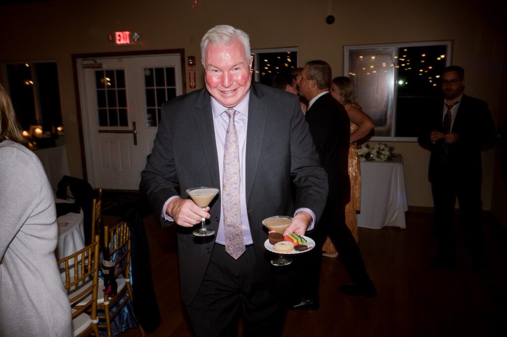 Kirsten and AJ’s September Wedding at Arrow Park, NY
Kirsten and AJ’s wedding day was a bit chilly and rainy, but their flexibility and positivity turned the day into a magical celebration. Originally planned for the garden, the ceremony was moved indoors due to the autumn rain. The staff at Arrow Park seamlessly transitioned the setup to the mansion’s main floor, creating an intimate and elegant ceremony space. The historic charm of the mansion, with its grand details and warm ambiance, added a cozy, romantic touch to their special day.
Kirsten, a talented fashion designer, surprised everyone—including her groom, AJ—by wearing a stunning black velvet strapless dress with an oversized white bow draping dramatically down the back. She designed the dress herself, and it was a show-stopper that perfectly reflected her unique style. The ceremony was heartfelt and personal, with family and friends gathering close to witness Kirsten and AJ’s vows.
After the ceremony, the main mansion was transformed to host a lively cocktail hour. Guests mingled and enjoyed delicious hors d'oeuvres while the reception space in the pavilion was being prepared. Kirsten and AJ’s attention to detail shone through in their décor choices, including the black-and-white checkered flooring that gave the pavilion a retro vibe. It was a perfect blend of modern chic and classic sophistication.
The reception began with Kirsten and AJ’s grand entrance, greeted by cheers from their guests. Their first dance was sweet and endearing, setting the tone for a night of joy and celebration. As the evening progressed, the party ramped up with enthusiastic dancing, heartfelt toasts, and even a surprise performance—a few uncles took the mic for an impromptu rap song that brought the house down.
Arrow Park provided the perfect backdrop for Kirsten and AJ’s wedding. With its blend of natural beauty and historic architecture, it’s an ideal venue for couples seeking a mix of indoor and outdoor spaces. The mansion offers a timeless elegance, while the pavilion provides a versatile setting for larger receptions.
Planning Tips for Future Couples at Arrow Park:
1. Have a Rain Plan: September weather can be unpredictable, so work with the Arrow Park staff to plan for both indoor and outdoor options. The mansion’s interiors provide a stunning alternative for ceremonies or cocktail hours.
2. Maximize the Pavilion: The pavilion’s spacious layout can accommodate various themes and setups. Consider unique flooring, lighting, or drapery to make the space your own.
3. Embrace the Venue’s Charm: Use the mansion’s historic features—like the fireplaces and vintage decor—as part of your wedding aesthetic. It’s a built-in backdrop that needs little embellishment.
4. Plan Time for Photos: Arrow Park’s grounds are breathtaking, especially in the fall. Schedule time with your photographer to capture the beauty of the lake, gardens, and mansion.
Kirsten and AJ’s wedding was a true testament to the power of creativity, adaptability, and love. Their celebration at Arrow Park was unforgettable, and I’m grateful to have been a part of their special day.
Thankful for all the wedding vendors that made this day possible:⁠
Venue: @arrowparkny
Catering: @lovenrosemary
Kirsten and AJ Arrow Park NY Wedding documented by Karis from Hey Karis New York, Brooklyn, Hudson Valley NY and Catskills NY and NJ Wedding and NYC Elopement Photographer.
