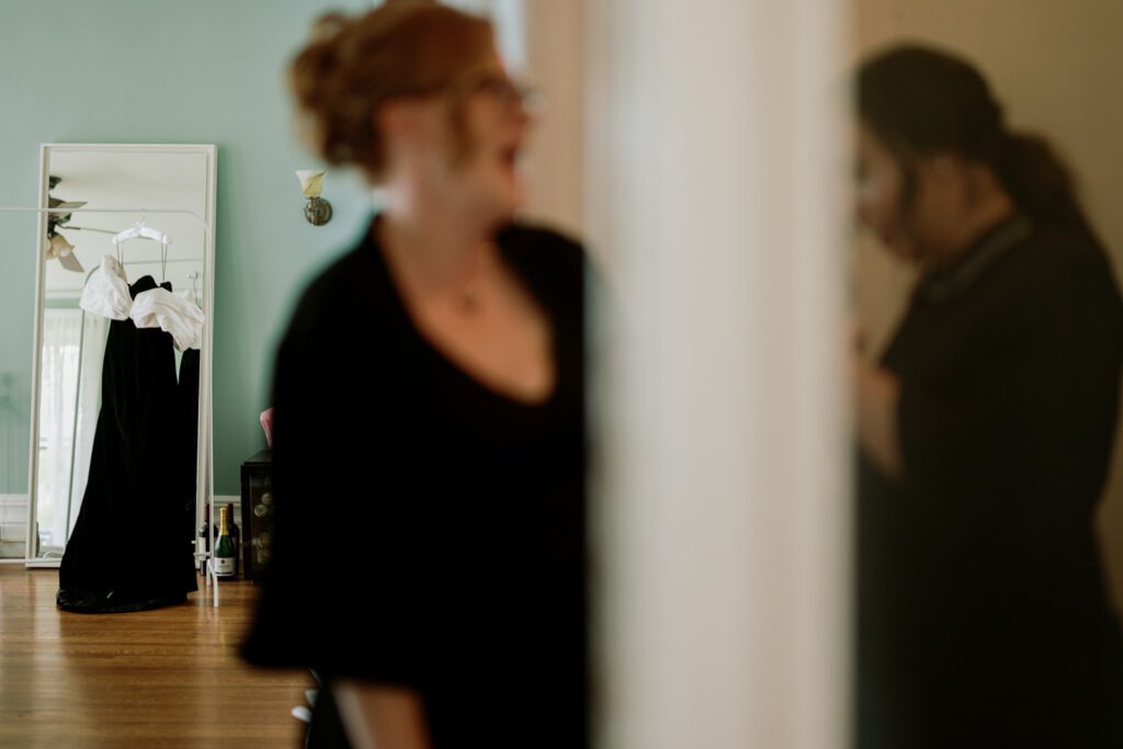 Kirsten and AJ’s September Wedding at Arrow Park, NY
Kirsten and AJ’s wedding day was a bit chilly and rainy, but their flexibility and positivity turned the day into a magical celebration. Originally planned for the garden, the ceremony was moved indoors due to the autumn rain. The staff at Arrow Park seamlessly transitioned the setup to the mansion’s main floor, creating an intimate and elegant ceremony space. The historic charm of the mansion, with its grand details and warm ambiance, added a cozy, romantic touch to their special day.
Kirsten, a talented fashion designer, surprised everyone—including her groom, AJ—by wearing a stunning black velvet strapless dress with an oversized white bow draping dramatically down the back. She designed the dress herself, and it was a show-stopper that perfectly reflected her unique style. The ceremony was heartfelt and personal, with family and friends gathering close to witness Kirsten and AJ’s vows.
After the ceremony, the main mansion was transformed to host a lively cocktail hour. Guests mingled and enjoyed delicious hors d'oeuvres while the reception space in the pavilion was being prepared. Kirsten and AJ’s attention to detail shone through in their décor choices, including the black-and-white checkered flooring that gave the pavilion a retro vibe. It was a perfect blend of modern chic and classic sophistication.
The reception began with Kirsten and AJ’s grand entrance, greeted by cheers from their guests. Their first dance was sweet and endearing, setting the tone for a night of joy and celebration. As the evening progressed, the party ramped up with enthusiastic dancing, heartfelt toasts, and even a surprise performance—a few uncles took the mic for an impromptu rap song that brought the house down.
Arrow Park provided the perfect backdrop for Kirsten and AJ’s wedding. With its blend of natural beauty and historic architecture, it’s an ideal venue for couples seeking a mix of indoor and outdoor spaces. The mansion offers a timeless elegance, while the pavilion provides a versatile setting for larger receptions.
Planning Tips for Future Couples at Arrow Park:
1. Have a Rain Plan: September weather can be unpredictable, so work with the Arrow Park staff to plan for both indoor and outdoor options. The mansion’s interiors provide a stunning alternative for ceremonies or cocktail hours.
2. Maximize the Pavilion: The pavilion’s spacious layout can accommodate various themes and setups. Consider unique flooring, lighting, or drapery to make the space your own.
3. Embrace the Venue’s Charm: Use the mansion’s historic features—like the fireplaces and vintage decor—as part of your wedding aesthetic. It’s a built-in backdrop that needs little embellishment.
4. Plan Time for Photos: Arrow Park’s grounds are breathtaking, especially in the fall. Schedule time with your photographer to capture the beauty of the lake, gardens, and mansion.
Kirsten and AJ’s wedding was a true testament to the power of creativity, adaptability, and love. Their celebration at Arrow Park was unforgettable, and I’m grateful to have been a part of their special day.
Thankful for all the wedding vendors that made this day possible:⁠
Venue: @arrowparkny
Catering: @lovenrosemary
Kirsten and AJ Arrow Park NY Wedding documented by Karis from Hey Karis New York, Brooklyn, Hudson Valley NY and Catskills NY and NJ Wedding and NYC Elopement Photographer.