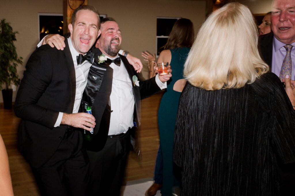 Kirsten and AJ’s September Wedding at Arrow Park, NY
Kirsten and AJ’s wedding day was a bit chilly and rainy, but their flexibility and positivity turned the day into a magical celebration. Originally planned for the garden, the ceremony was moved indoors due to the autumn rain. The staff at Arrow Park seamlessly transitioned the setup to the mansion’s main floor, creating an intimate and elegant ceremony space. The historic charm of the mansion, with its grand details and warm ambiance, added a cozy, romantic touch to their special day.
Kirsten, a talented fashion designer, surprised everyone—including her groom, AJ—by wearing a stunning black velvet strapless dress with an oversized white bow draping dramatically down the back. She designed the dress herself, and it was a show-stopper that perfectly reflected her unique style. The ceremony was heartfelt and personal, with family and friends gathering close to witness Kirsten and AJ’s vows.
After the ceremony, the main mansion was transformed to host a lively cocktail hour. Guests mingled and enjoyed delicious hors d'oeuvres while the reception space in the pavilion was being prepared. Kirsten and AJ’s attention to detail shone through in their décor choices, including the black-and-white checkered flooring that gave the pavilion a retro vibe. It was a perfect blend of modern chic and classic sophistication.
The reception began with Kirsten and AJ’s grand entrance, greeted by cheers from their guests. Their first dance was sweet and endearing, setting the tone for a night of joy and celebration. As the evening progressed, the party ramped up with enthusiastic dancing, heartfelt toasts, and even a surprise performance—a few uncles took the mic for an impromptu rap song that brought the house down.
Arrow Park provided the perfect backdrop for Kirsten and AJ’s wedding. With its blend of natural beauty and historic architecture, it’s an ideal venue for couples seeking a mix of indoor and outdoor spaces. The mansion offers a timeless elegance, while the pavilion provides a versatile setting for larger receptions.
Planning Tips for Future Couples at Arrow Park:
1. Have a Rain Plan: September weather can be unpredictable, so work with the Arrow Park staff to plan for both indoor and outdoor options. The mansion’s interiors provide a stunning alternative for ceremonies or cocktail hours.
2. Maximize the Pavilion: The pavilion’s spacious layout can accommodate various themes and setups. Consider unique flooring, lighting, or drapery to make the space your own.
3. Embrace the Venue’s Charm: Use the mansion’s historic features—like the fireplaces and vintage decor—as part of your wedding aesthetic. It’s a built-in backdrop that needs little embellishment.
4. Plan Time for Photos: Arrow Park’s grounds are breathtaking, especially in the fall. Schedule time with your photographer to capture the beauty of the lake, gardens, and mansion.
Kirsten and AJ’s wedding was a true testament to the power of creativity, adaptability, and love. Their celebration at Arrow Park was unforgettable, and I’m grateful to have been a part of their special day.
Thankful for all the wedding vendors that made this day possible:⁠
Venue: @arrowparkny
Catering: @lovenrosemary
Kirsten and AJ Arrow Park NY Wedding documented by Karis from Hey Karis New York, Brooklyn, Hudson Valley NY and Catskills NY and NJ Wedding and NYC Elopement Photographer.