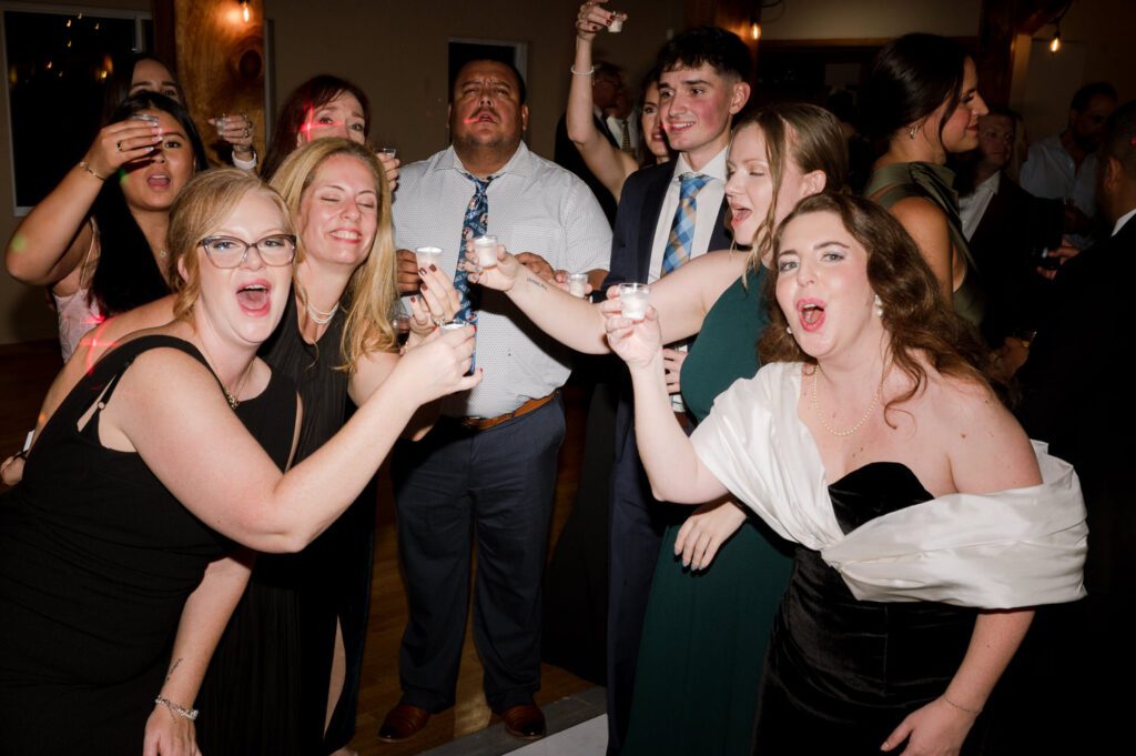 Kirsten and AJ’s September Wedding at Arrow Park, NY
Kirsten and AJ’s wedding day was a bit chilly and rainy, but their flexibility and positivity turned the day into a magical celebration. Originally planned for the garden, the ceremony was moved indoors due to the autumn rain. The staff at Arrow Park seamlessly transitioned the setup to the mansion’s main floor, creating an intimate and elegant ceremony space. The historic charm of the mansion, with its grand details and warm ambiance, added a cozy, romantic touch to their special day.
Kirsten, a talented fashion designer, surprised everyone—including her groom, AJ—by wearing a stunning black velvet strapless dress with an oversized white bow draping dramatically down the back. She designed the dress herself, and it was a show-stopper that perfectly reflected her unique style. The ceremony was heartfelt and personal, with family and friends gathering close to witness Kirsten and AJ’s vows.
After the ceremony, the main mansion was transformed to host a lively cocktail hour. Guests mingled and enjoyed delicious hors d'oeuvres while the reception space in the pavilion was being prepared. Kirsten and AJ’s attention to detail shone through in their décor choices, including the black-and-white checkered flooring that gave the pavilion a retro vibe. It was a perfect blend of modern chic and classic sophistication.
The reception began with Kirsten and AJ’s grand entrance, greeted by cheers from their guests. Their first dance was sweet and endearing, setting the tone for a night of joy and celebration. As the evening progressed, the party ramped up with enthusiastic dancing, heartfelt toasts, and even a surprise performance—a few uncles took the mic for an impromptu rap song that brought the house down.
Arrow Park provided the perfect backdrop for Kirsten and AJ’s wedding. With its blend of natural beauty and historic architecture, it’s an ideal venue for couples seeking a mix of indoor and outdoor spaces. The mansion offers a timeless elegance, while the pavilion provides a versatile setting for larger receptions.
Planning Tips for Future Couples at Arrow Park:
1. Have a Rain Plan: September weather can be unpredictable, so work with the Arrow Park staff to plan for both indoor and outdoor options. The mansion’s interiors provide a stunning alternative for ceremonies or cocktail hours.
2. Maximize the Pavilion: The pavilion’s spacious layout can accommodate various themes and setups. Consider unique flooring, lighting, or drapery to make the space your own.
3. Embrace the Venue’s Charm: Use the mansion’s historic features—like the fireplaces and vintage decor—as part of your wedding aesthetic. It’s a built-in backdrop that needs little embellishment.
4. Plan Time for Photos: Arrow Park’s grounds are breathtaking, especially in the fall. Schedule time with your photographer to capture the beauty of the lake, gardens, and mansion.
Kirsten and AJ’s wedding was a true testament to the power of creativity, adaptability, and love. Their celebration at Arrow Park was unforgettable, and I’m grateful to have been a part of their special day.
Thankful for all the wedding vendors that made this day possible:⁠
Venue: @arrowparkny
Catering: @lovenrosemary
Kirsten and AJ Arrow Park NY Wedding documented by Karis from Hey Karis New York, Brooklyn, Hudson Valley NY and Catskills NY and NJ Wedding and NYC Elopement Photographer.