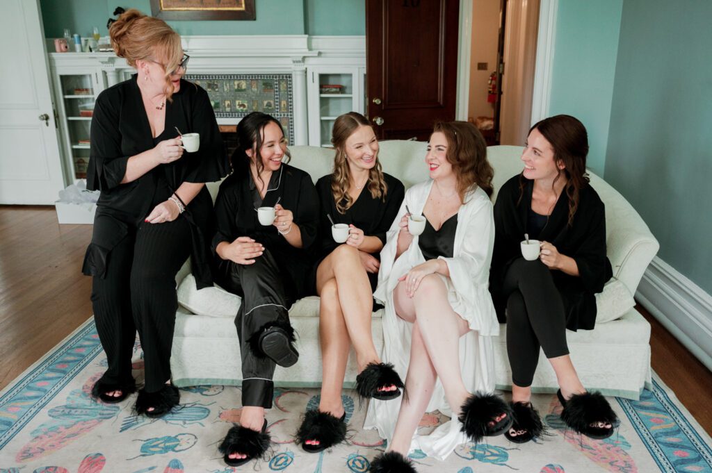 Kirsten and AJ’s September Wedding at Arrow Park, NY
Kirsten and AJ’s wedding day was a bit chilly and rainy, but their flexibility and positivity turned the day into a magical celebration. Originally planned for the garden, the ceremony was moved indoors due to the autumn rain. The staff at Arrow Park seamlessly transitioned the setup to the mansion’s main floor, creating an intimate and elegant ceremony space. The historic charm of the mansion, with its grand details and warm ambiance, added a cozy, romantic touch to their special day.
Kirsten, a talented fashion designer, surprised everyone—including her groom, AJ—by wearing a stunning black velvet strapless dress with an oversized white bow draping dramatically down the back. She designed the dress herself, and it was a show-stopper that perfectly reflected her unique style. The ceremony was heartfelt and personal, with family and friends gathering close to witness Kirsten and AJ’s vows.
After the ceremony, the main mansion was transformed to host a lively cocktail hour. Guests mingled and enjoyed delicious hors d'oeuvres while the reception space in the pavilion was being prepared. Kirsten and AJ’s attention to detail shone through in their décor choices, including the black-and-white checkered flooring that gave the pavilion a retro vibe. It was a perfect blend of modern chic and classic sophistication.
The reception began with Kirsten and AJ’s grand entrance, greeted by cheers from their guests. Their first dance was sweet and endearing, setting the tone for a night of joy and celebration. As the evening progressed, the party ramped up with enthusiastic dancing, heartfelt toasts, and even a surprise performance—a few uncles took the mic for an impromptu rap song that brought the house down.
Arrow Park provided the perfect backdrop for Kirsten and AJ’s wedding. With its blend of natural beauty and historic architecture, it’s an ideal venue for couples seeking a mix of indoor and outdoor spaces. The mansion offers a timeless elegance, while the pavilion provides a versatile setting for larger receptions.
Planning Tips for Future Couples at Arrow Park:
1. Have a Rain Plan: September weather can be unpredictable, so work with the Arrow Park staff to plan for both indoor and outdoor options. The mansion’s interiors provide a stunning alternative for ceremonies or cocktail hours.
2. Maximize the Pavilion: The pavilion’s spacious layout can accommodate various themes and setups. Consider unique flooring, lighting, or drapery to make the space your own.
3. Embrace the Venue’s Charm: Use the mansion’s historic features—like the fireplaces and vintage decor—as part of your wedding aesthetic. It’s a built-in backdrop that needs little embellishment.
4. Plan Time for Photos: Arrow Park’s grounds are breathtaking, especially in the fall. Schedule time with your photographer to capture the beauty of the lake, gardens, and mansion.
Kirsten and AJ’s wedding was a true testament to the power of creativity, adaptability, and love. Their celebration at Arrow Park was unforgettable, and I’m grateful to have been a part of their special day.
Thankful for all the wedding vendors that made this day possible:⁠
Venue: @arrowparkny
Catering: @lovenrosemary
Kirsten and AJ Arrow Park NY Wedding documented by Karis from Hey Karis New York, Brooklyn, Hudson Valley NY and Catskills NY and NJ Wedding and NYC Elopement Photographer.