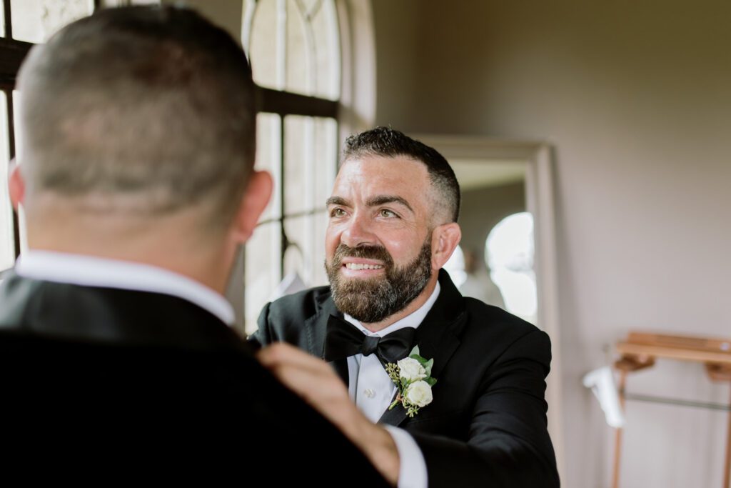 Kirsten and AJ’s September Wedding at Arrow Park, NY
Kirsten and AJ’s wedding day was a bit chilly and rainy, but their flexibility and positivity turned the day into a magical celebration. Originally planned for the garden, the ceremony was moved indoors due to the autumn rain. The staff at Arrow Park seamlessly transitioned the setup to the mansion’s main floor, creating an intimate and elegant ceremony space. The historic charm of the mansion, with its grand details and warm ambiance, added a cozy, romantic touch to their special day.
Kirsten, a talented fashion designer, surprised everyone—including her groom, AJ—by wearing a stunning black velvet strapless dress with an oversized white bow draping dramatically down the back. She designed the dress herself, and it was a show-stopper that perfectly reflected her unique style. The ceremony was heartfelt and personal, with family and friends gathering close to witness Kirsten and AJ’s vows.
After the ceremony, the main mansion was transformed to host a lively cocktail hour. Guests mingled and enjoyed delicious hors d'oeuvres while the reception space in the pavilion was being prepared. Kirsten and AJ’s attention to detail shone through in their décor choices, including the black-and-white checkered flooring that gave the pavilion a retro vibe. It was a perfect blend of modern chic and classic sophistication.
The reception began with Kirsten and AJ’s grand entrance, greeted by cheers from their guests. Their first dance was sweet and endearing, setting the tone for a night of joy and celebration. As the evening progressed, the party ramped up with enthusiastic dancing, heartfelt toasts, and even a surprise performance—a few uncles took the mic for an impromptu rap song that brought the house down.
Arrow Park provided the perfect backdrop for Kirsten and AJ’s wedding. With its blend of natural beauty and historic architecture, it’s an ideal venue for couples seeking a mix of indoor and outdoor spaces. The mansion offers a timeless elegance, while the pavilion provides a versatile setting for larger receptions.
Planning Tips for Future Couples at Arrow Park:
1. Have a Rain Plan: September weather can be unpredictable, so work with the Arrow Park staff to plan for both indoor and outdoor options. The mansion’s interiors provide a stunning alternative for ceremonies or cocktail hours.
2. Maximize the Pavilion: The pavilion’s spacious layout can accommodate various themes and setups. Consider unique flooring, lighting, or drapery to make the space your own.
3. Embrace the Venue’s Charm: Use the mansion’s historic features—like the fireplaces and vintage decor—as part of your wedding aesthetic. It’s a built-in backdrop that needs little embellishment.
4. Plan Time for Photos: Arrow Park’s grounds are breathtaking, especially in the fall. Schedule time with your photographer to capture the beauty of the lake, gardens, and mansion.
Kirsten and AJ’s wedding was a true testament to the power of creativity, adaptability, and love. Their celebration at Arrow Park was unforgettable, and I’m grateful to have been a part of their special day.
Thankful for all the wedding vendors that made this day possible:⁠
Venue: @arrowparkny
Catering: @lovenrosemary
Kirsten and AJ Arrow Park NY Wedding documented by Karis from Hey Karis New York, Brooklyn, Hudson Valley NY and Catskills NY and NJ Wedding and NYC Elopement Photographer.