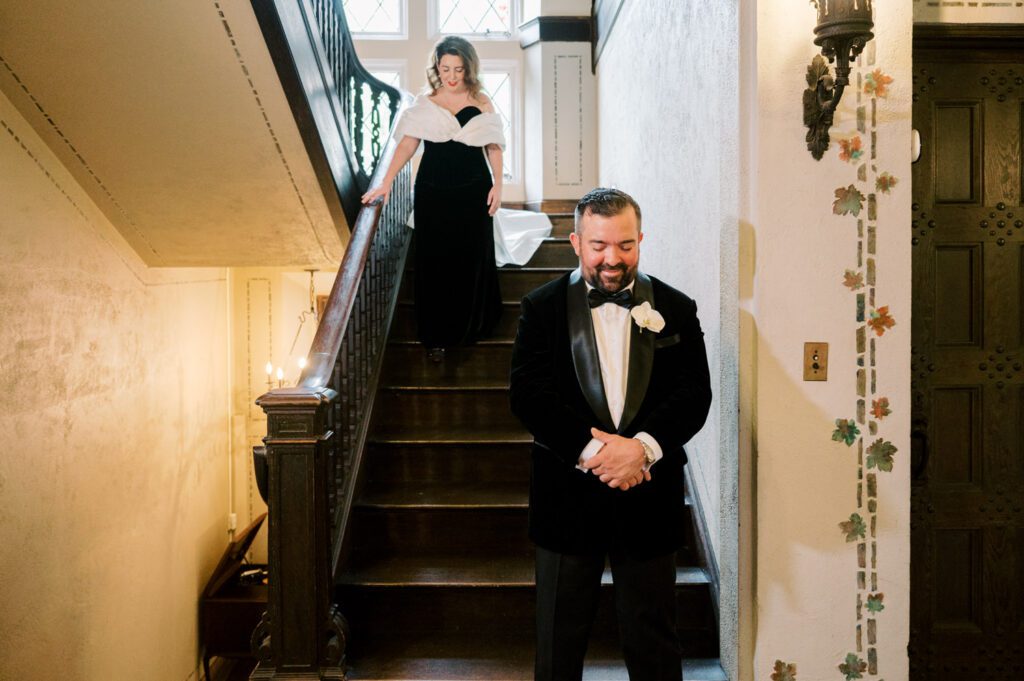 Kirsten and AJ’s September Wedding at Arrow Park, NY
Kirsten and AJ’s wedding day was a bit chilly and rainy, but their flexibility and positivity turned the day into a magical celebration. Originally planned for the garden, the ceremony was moved indoors due to the autumn rain. The staff at Arrow Park seamlessly transitioned the setup to the mansion’s main floor, creating an intimate and elegant ceremony space. The historic charm of the mansion, with its grand details and warm ambiance, added a cozy, romantic touch to their special day.
Kirsten, a talented fashion designer, surprised everyone—including her groom, AJ—by wearing a stunning black velvet strapless dress with an oversized white bow draping dramatically down the back. She designed the dress herself, and it was a show-stopper that perfectly reflected her unique style. The ceremony was heartfelt and personal, with family and friends gathering close to witness Kirsten and AJ’s vows.
After the ceremony, the main mansion was transformed to host a lively cocktail hour. Guests mingled and enjoyed delicious hors d'oeuvres while the reception space in the pavilion was being prepared. Kirsten and AJ’s attention to detail shone through in their décor choices, including the black-and-white checkered flooring that gave the pavilion a retro vibe. It was a perfect blend of modern chic and classic sophistication.
The reception began with Kirsten and AJ’s grand entrance, greeted by cheers from their guests. Their first dance was sweet and endearing, setting the tone for a night of joy and celebration. As the evening progressed, the party ramped up with enthusiastic dancing, heartfelt toasts, and even a surprise performance—a few uncles took the mic for an impromptu rap song that brought the house down.
Arrow Park provided the perfect backdrop for Kirsten and AJ’s wedding. With its blend of natural beauty and historic architecture, it’s an ideal venue for couples seeking a mix of indoor and outdoor spaces. The mansion offers a timeless elegance, while the pavilion provides a versatile setting for larger receptions.
Planning Tips for Future Couples at Arrow Park:
1. Have a Rain Plan: September weather can be unpredictable, so work with the Arrow Park staff to plan for both indoor and outdoor options. The mansion’s interiors provide a stunning alternative for ceremonies or cocktail hours.
2. Maximize the Pavilion: The pavilion’s spacious layout can accommodate various themes and setups. Consider unique flooring, lighting, or drapery to make the space your own.
3. Embrace the Venue’s Charm: Use the mansion’s historic features—like the fireplaces and vintage decor—as part of your wedding aesthetic. It’s a built-in backdrop that needs little embellishment.
4. Plan Time for Photos: Arrow Park’s grounds are breathtaking, especially in the fall. Schedule time with your photographer to capture the beauty of the lake, gardens, and mansion.
Kirsten and AJ’s wedding was a true testament to the power of creativity, adaptability, and love. Their celebration at Arrow Park was unforgettable, and I’m grateful to have been a part of their special day.
Thankful for all the wedding vendors that made this day possible:⁠
Venue: @arrowparkny
Catering: @lovenrosemary
Kirsten and AJ Arrow Park NY Wedding documented by Karis from Hey Karis New York, Brooklyn, Hudson Valley NY and Catskills NY and NJ Wedding and NYC Elopement Photographer.