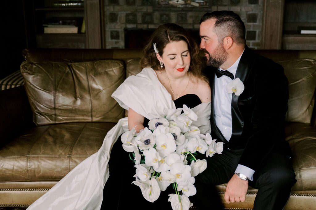 Kirsten and AJ’s September Wedding at Arrow Park, NY
Kirsten and AJ’s wedding day was a bit chilly and rainy, but their flexibility and positivity turned the day into a magical celebration. Originally planned for the garden, the ceremony was moved indoors due to the autumn rain. The staff at Arrow Park seamlessly transitioned the setup to the mansion’s main floor, creating an intimate and elegant ceremony space. The historic charm of the mansion, with its grand details and warm ambiance, added a cozy, romantic touch to their special day.
Kirsten, a talented fashion designer, surprised everyone—including her groom, AJ—by wearing a stunning black velvet strapless dress with an oversized white bow draping dramatically down the back. She designed the dress herself, and it was a show-stopper that perfectly reflected her unique style. The ceremony was heartfelt and personal, with family and friends gathering close to witness Kirsten and AJ’s vows.
After the ceremony, the main mansion was transformed to host a lively cocktail hour. Guests mingled and enjoyed delicious hors d'oeuvres while the reception space in the pavilion was being prepared. Kirsten and AJ’s attention to detail shone through in their décor choices, including the black-and-white checkered flooring that gave the pavilion a retro vibe. It was a perfect blend of modern chic and classic sophistication.
The reception began with Kirsten and AJ’s grand entrance, greeted by cheers from their guests. Their first dance was sweet and endearing, setting the tone for a night of joy and celebration. As the evening progressed, the party ramped up with enthusiastic dancing, heartfelt toasts, and even a surprise performance—a few uncles took the mic for an impromptu rap song that brought the house down.
Arrow Park provided the perfect backdrop for Kirsten and AJ’s wedding. With its blend of natural beauty and historic architecture, it’s an ideal venue for couples seeking a mix of indoor and outdoor spaces. The mansion offers a timeless elegance, while the pavilion provides a versatile setting for larger receptions.
Planning Tips for Future Couples at Arrow Park:
1. Have a Rain Plan: September weather can be unpredictable, so work with the Arrow Park staff to plan for both indoor and outdoor options. The mansion’s interiors provide a stunning alternative for ceremonies or cocktail hours.
2. Maximize the Pavilion: The pavilion’s spacious layout can accommodate various themes and setups. Consider unique flooring, lighting, or drapery to make the space your own.
3. Embrace the Venue’s Charm: Use the mansion’s historic features—like the fireplaces and vintage decor—as part of your wedding aesthetic. It’s a built-in backdrop that needs little embellishment.
4. Plan Time for Photos: Arrow Park’s grounds are breathtaking, especially in the fall. Schedule time with your photographer to capture the beauty of the lake, gardens, and mansion.
Kirsten and AJ’s wedding was a true testament to the power of creativity, adaptability, and love. Their celebration at Arrow Park was unforgettable, and I’m grateful to have been a part of their special day.
Thankful for all the wedding vendors that made this day possible:⁠
Venue: @arrowparkny
Catering: @lovenrosemary
Kirsten and AJ Arrow Park NY Wedding documented by Karis from Hey Karis New York, Brooklyn, Hudson Valley NY and Catskills NY and NJ Wedding and NYC Elopement Photographer.