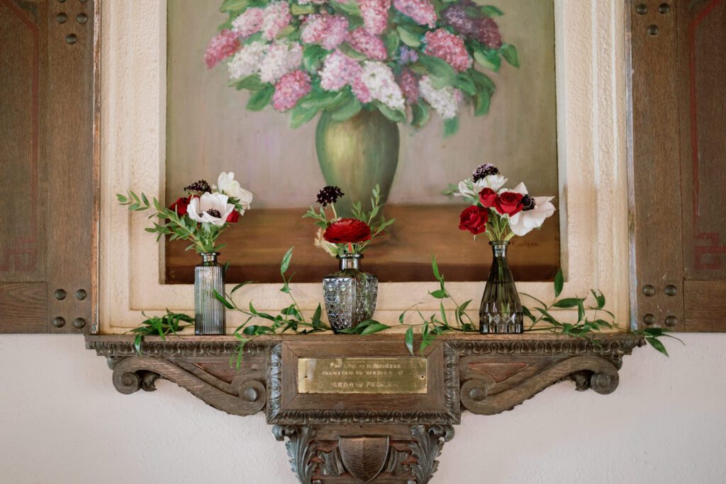 Kirsten and AJ’s September Wedding at Arrow Park, NY
Kirsten and AJ’s wedding day was a bit chilly and rainy, but their flexibility and positivity turned the day into a magical celebration. Originally planned for the garden, the ceremony was moved indoors due to the autumn rain. The staff at Arrow Park seamlessly transitioned the setup to the mansion’s main floor, creating an intimate and elegant ceremony space. The historic charm of the mansion, with its grand details and warm ambiance, added a cozy, romantic touch to their special day.
Kirsten, a talented fashion designer, surprised everyone—including her groom, AJ—by wearing a stunning black velvet strapless dress with an oversized white bow draping dramatically down the back. She designed the dress herself, and it was a show-stopper that perfectly reflected her unique style. The ceremony was heartfelt and personal, with family and friends gathering close to witness Kirsten and AJ’s vows.
After the ceremony, the main mansion was transformed to host a lively cocktail hour. Guests mingled and enjoyed delicious hors d'oeuvres while the reception space in the pavilion was being prepared. Kirsten and AJ’s attention to detail shone through in their décor choices, including the black-and-white checkered flooring that gave the pavilion a retro vibe. It was a perfect blend of modern chic and classic sophistication.
The reception began with Kirsten and AJ’s grand entrance, greeted by cheers from their guests. Their first dance was sweet and endearing, setting the tone for a night of joy and celebration. As the evening progressed, the party ramped up with enthusiastic dancing, heartfelt toasts, and even a surprise performance—a few uncles took the mic for an impromptu rap song that brought the house down.
Arrow Park provided the perfect backdrop for Kirsten and AJ’s wedding. With its blend of natural beauty and historic architecture, it’s an ideal venue for couples seeking a mix of indoor and outdoor spaces. The mansion offers a timeless elegance, while the pavilion provides a versatile setting for larger receptions.
Planning Tips for Future Couples at Arrow Park:
1. Have a Rain Plan: September weather can be unpredictable, so work with the Arrow Park staff to plan for both indoor and outdoor options. The mansion’s interiors provide a stunning alternative for ceremonies or cocktail hours.
2. Maximize the Pavilion: The pavilion’s spacious layout can accommodate various themes and setups. Consider unique flooring, lighting, or drapery to make the space your own.
3. Embrace the Venue’s Charm: Use the mansion’s historic features—like the fireplaces and vintage decor—as part of your wedding aesthetic. It’s a built-in backdrop that needs little embellishment.
4. Plan Time for Photos: Arrow Park’s grounds are breathtaking, especially in the fall. Schedule time with your photographer to capture the beauty of the lake, gardens, and mansion.
Kirsten and AJ’s wedding was a true testament to the power of creativity, adaptability, and love. Their celebration at Arrow Park was unforgettable, and I’m grateful to have been a part of their special day.
Thankful for all the wedding vendors that made this day possible:⁠
Venue: @arrowparkny
Catering: @lovenrosemary
Kirsten and AJ Arrow Park NY Wedding documented by Karis from Hey Karis New York, Brooklyn, Hudson Valley NY and Catskills NY and NJ Wedding and NYC Elopement Photographer.