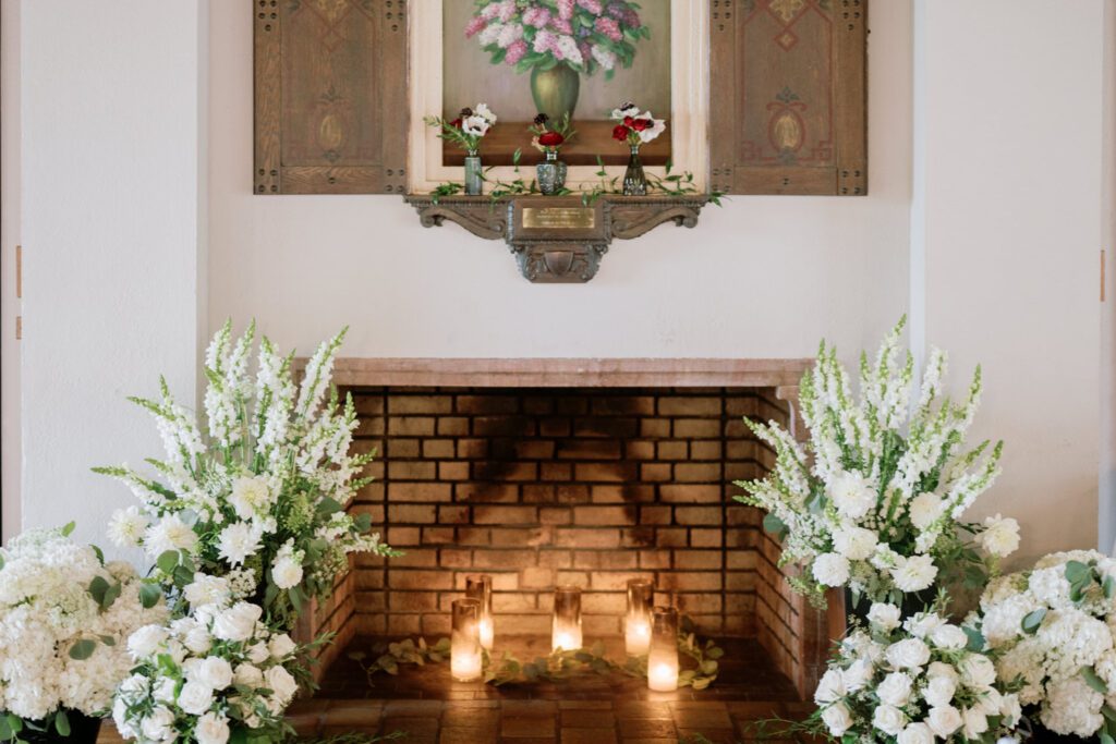 Kirsten and AJ’s September Wedding at Arrow Park, NY
Kirsten and AJ’s wedding day was a bit chilly and rainy, but their flexibility and positivity turned the day into a magical celebration. Originally planned for the garden, the ceremony was moved indoors due to the autumn rain. The staff at Arrow Park seamlessly transitioned the setup to the mansion’s main floor, creating an intimate and elegant ceremony space. The historic charm of the mansion, with its grand details and warm ambiance, added a cozy, romantic touch to their special day.
Kirsten, a talented fashion designer, surprised everyone—including her groom, AJ—by wearing a stunning black velvet strapless dress with an oversized white bow draping dramatically down the back. She designed the dress herself, and it was a show-stopper that perfectly reflected her unique style. The ceremony was heartfelt and personal, with family and friends gathering close to witness Kirsten and AJ’s vows.
After the ceremony, the main mansion was transformed to host a lively cocktail hour. Guests mingled and enjoyed delicious hors d'oeuvres while the reception space in the pavilion was being prepared. Kirsten and AJ’s attention to detail shone through in their décor choices, including the black-and-white checkered flooring that gave the pavilion a retro vibe. It was a perfect blend of modern chic and classic sophistication.
The reception began with Kirsten and AJ’s grand entrance, greeted by cheers from their guests. Their first dance was sweet and endearing, setting the tone for a night of joy and celebration. As the evening progressed, the party ramped up with enthusiastic dancing, heartfelt toasts, and even a surprise performance—a few uncles took the mic for an impromptu rap song that brought the house down.
Arrow Park provided the perfect backdrop for Kirsten and AJ’s wedding. With its blend of natural beauty and historic architecture, it’s an ideal venue for couples seeking a mix of indoor and outdoor spaces. The mansion offers a timeless elegance, while the pavilion provides a versatile setting for larger receptions.
Planning Tips for Future Couples at Arrow Park:
1. Have a Rain Plan: September weather can be unpredictable, so work with the Arrow Park staff to plan for both indoor and outdoor options. The mansion’s interiors provide a stunning alternative for ceremonies or cocktail hours.
2. Maximize the Pavilion: The pavilion’s spacious layout can accommodate various themes and setups. Consider unique flooring, lighting, or drapery to make the space your own.
3. Embrace the Venue’s Charm: Use the mansion’s historic features—like the fireplaces and vintage decor—as part of your wedding aesthetic. It’s a built-in backdrop that needs little embellishment.
4. Plan Time for Photos: Arrow Park’s grounds are breathtaking, especially in the fall. Schedule time with your photographer to capture the beauty of the lake, gardens, and mansion.
Kirsten and AJ’s wedding was a true testament to the power of creativity, adaptability, and love. Their celebration at Arrow Park was unforgettable, and I’m grateful to have been a part of their special day.
Thankful for all the wedding vendors that made this day possible:⁠
Venue: @arrowparkny
Catering: @lovenrosemary
Kirsten and AJ Arrow Park NY Wedding documented by Karis from Hey Karis New York, Brooklyn, Hudson Valley NY and Catskills NY and NJ Wedding and NYC Elopement Photographer.