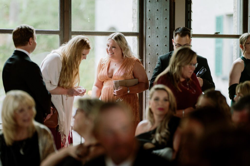 Kirsten and AJ’s September Wedding at Arrow Park, NY
Kirsten and AJ’s wedding day was a bit chilly and rainy, but their flexibility and positivity turned the day into a magical celebration. Originally planned for the garden, the ceremony was moved indoors due to the autumn rain. The staff at Arrow Park seamlessly transitioned the setup to the mansion’s main floor, creating an intimate and elegant ceremony space. The historic charm of the mansion, with its grand details and warm ambiance, added a cozy, romantic touch to their special day.
Kirsten, a talented fashion designer, surprised everyone—including her groom, AJ—by wearing a stunning black velvet strapless dress with an oversized white bow draping dramatically down the back. She designed the dress herself, and it was a show-stopper that perfectly reflected her unique style. The ceremony was heartfelt and personal, with family and friends gathering close to witness Kirsten and AJ’s vows.
After the ceremony, the main mansion was transformed to host a lively cocktail hour. Guests mingled and enjoyed delicious hors d'oeuvres while the reception space in the pavilion was being prepared. Kirsten and AJ’s attention to detail shone through in their décor choices, including the black-and-white checkered flooring that gave the pavilion a retro vibe. It was a perfect blend of modern chic and classic sophistication.
The reception began with Kirsten and AJ’s grand entrance, greeted by cheers from their guests. Their first dance was sweet and endearing, setting the tone for a night of joy and celebration. As the evening progressed, the party ramped up with enthusiastic dancing, heartfelt toasts, and even a surprise performance—a few uncles took the mic for an impromptu rap song that brought the house down.
Arrow Park provided the perfect backdrop for Kirsten and AJ’s wedding. With its blend of natural beauty and historic architecture, it’s an ideal venue for couples seeking a mix of indoor and outdoor spaces. The mansion offers a timeless elegance, while the pavilion provides a versatile setting for larger receptions.
Planning Tips for Future Couples at Arrow Park:
1. Have a Rain Plan: September weather can be unpredictable, so work with the Arrow Park staff to plan for both indoor and outdoor options. The mansion’s interiors provide a stunning alternative for ceremonies or cocktail hours.
2. Maximize the Pavilion: The pavilion’s spacious layout can accommodate various themes and setups. Consider unique flooring, lighting, or drapery to make the space your own.
3. Embrace the Venue’s Charm: Use the mansion’s historic features—like the fireplaces and vintage decor—as part of your wedding aesthetic. It’s a built-in backdrop that needs little embellishment.
4. Plan Time for Photos: Arrow Park’s grounds are breathtaking, especially in the fall. Schedule time with your photographer to capture the beauty of the lake, gardens, and mansion.
Kirsten and AJ’s wedding was a true testament to the power of creativity, adaptability, and love. Their celebration at Arrow Park was unforgettable, and I’m grateful to have been a part of their special day.
Thankful for all the wedding vendors that made this day possible:⁠
Venue: @arrowparkny
Catering: @lovenrosemary
Kirsten and AJ Arrow Park NY Wedding documented by Karis from Hey Karis New York, Brooklyn, Hudson Valley NY and Catskills NY and NJ Wedding and NYC Elopement Photographer.