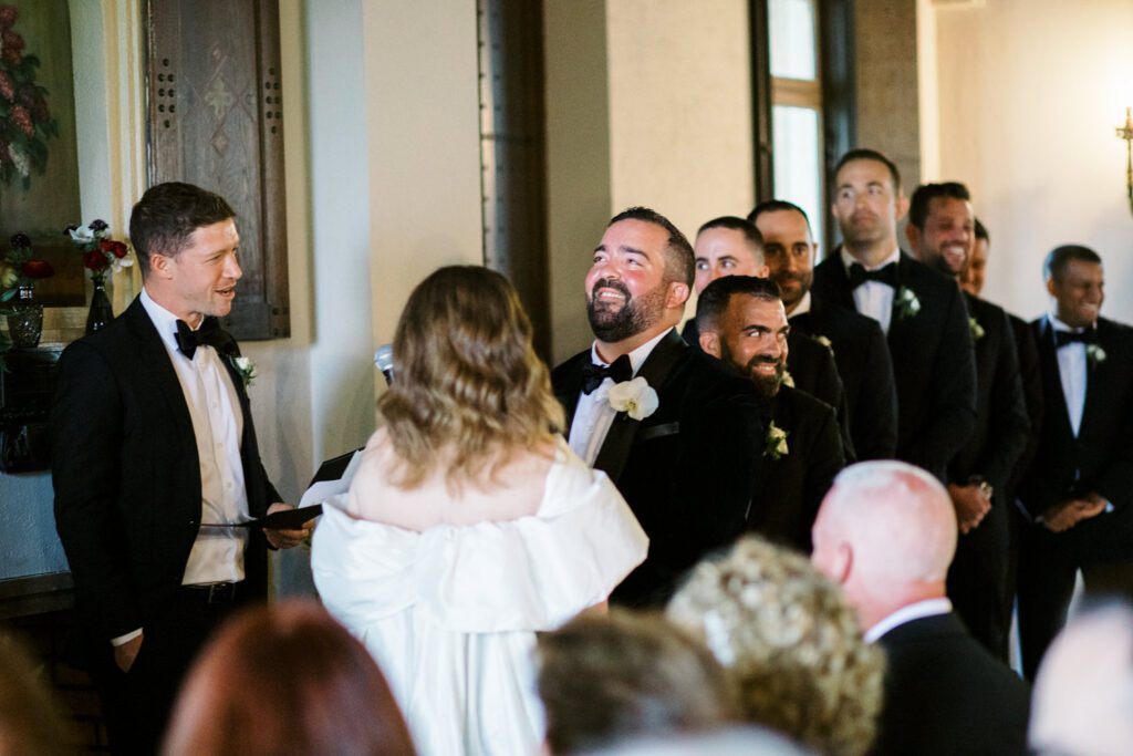 Kirsten and AJ’s September Wedding at Arrow Park, NY
Kirsten and AJ’s wedding day was a bit chilly and rainy, but their flexibility and positivity turned the day into a magical celebration. Originally planned for the garden, the ceremony was moved indoors due to the autumn rain. The staff at Arrow Park seamlessly transitioned the setup to the mansion’s main floor, creating an intimate and elegant ceremony space. The historic charm of the mansion, with its grand details and warm ambiance, added a cozy, romantic touch to their special day.
Kirsten, a talented fashion designer, surprised everyone—including her groom, AJ—by wearing a stunning black velvet strapless dress with an oversized white bow draping dramatically down the back. She designed the dress herself, and it was a show-stopper that perfectly reflected her unique style. The ceremony was heartfelt and personal, with family and friends gathering close to witness Kirsten and AJ’s vows.
After the ceremony, the main mansion was transformed to host a lively cocktail hour. Guests mingled and enjoyed delicious hors d'oeuvres while the reception space in the pavilion was being prepared. Kirsten and AJ’s attention to detail shone through in their décor choices, including the black-and-white checkered flooring that gave the pavilion a retro vibe. It was a perfect blend of modern chic and classic sophistication.
The reception began with Kirsten and AJ’s grand entrance, greeted by cheers from their guests. Their first dance was sweet and endearing, setting the tone for a night of joy and celebration. As the evening progressed, the party ramped up with enthusiastic dancing, heartfelt toasts, and even a surprise performance—a few uncles took the mic for an impromptu rap song that brought the house down.
Arrow Park provided the perfect backdrop for Kirsten and AJ’s wedding. With its blend of natural beauty and historic architecture, it’s an ideal venue for couples seeking a mix of indoor and outdoor spaces. The mansion offers a timeless elegance, while the pavilion provides a versatile setting for larger receptions.
Planning Tips for Future Couples at Arrow Park:
1. Have a Rain Plan: September weather can be unpredictable, so work with the Arrow Park staff to plan for both indoor and outdoor options. The mansion’s interiors provide a stunning alternative for ceremonies or cocktail hours.
2. Maximize the Pavilion: The pavilion’s spacious layout can accommodate various themes and setups. Consider unique flooring, lighting, or drapery to make the space your own.
3. Embrace the Venue’s Charm: Use the mansion’s historic features—like the fireplaces and vintage decor—as part of your wedding aesthetic. It’s a built-in backdrop that needs little embellishment.
4. Plan Time for Photos: Arrow Park’s grounds are breathtaking, especially in the fall. Schedule time with your photographer to capture the beauty of the lake, gardens, and mansion.
Kirsten and AJ’s wedding was a true testament to the power of creativity, adaptability, and love. Their celebration at Arrow Park was unforgettable, and I’m grateful to have been a part of their special day.
Thankful for all the wedding vendors that made this day possible:⁠
Venue: @arrowparkny
Catering: @lovenrosemary
Kirsten and AJ Arrow Park NY Wedding documented by Karis from Hey Karis New York, Brooklyn, Hudson Valley NY and Catskills NY and NJ Wedding and NYC Elopement Photographer.