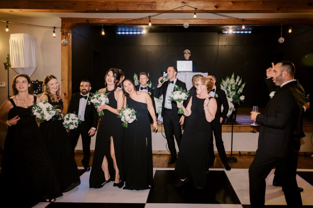 Kirsten and AJ’s September Wedding at Arrow Park, NY
Kirsten and AJ’s wedding day was a bit chilly and rainy, but their flexibility and positivity turned the day into a magical celebration. Originally planned for the garden, the ceremony was moved indoors due to the autumn rain. The staff at Arrow Park seamlessly transitioned the setup to the mansion’s main floor, creating an intimate and elegant ceremony space. The historic charm of the mansion, with its grand details and warm ambiance, added a cozy, romantic touch to their special day.
Kirsten, a talented fashion designer, surprised everyone—including her groom, AJ—by wearing a stunning black velvet strapless dress with an oversized white bow draping dramatically down the back. She designed the dress herself, and it was a show-stopper that perfectly reflected her unique style. The ceremony was heartfelt and personal, with family and friends gathering close to witness Kirsten and AJ’s vows.
After the ceremony, the main mansion was transformed to host a lively cocktail hour. Guests mingled and enjoyed delicious hors d'oeuvres while the reception space in the pavilion was being prepared. Kirsten and AJ’s attention to detail shone through in their décor choices, including the black-and-white checkered flooring that gave the pavilion a retro vibe. It was a perfect blend of modern chic and classic sophistication.
The reception began with Kirsten and AJ’s grand entrance, greeted by cheers from their guests. Their first dance was sweet and endearing, setting the tone for a night of joy and celebration. As the evening progressed, the party ramped up with enthusiastic dancing, heartfelt toasts, and even a surprise performance—a few uncles took the mic for an impromptu rap song that brought the house down.
Arrow Park provided the perfect backdrop for Kirsten and AJ’s wedding. With its blend of natural beauty and historic architecture, it’s an ideal venue for couples seeking a mix of indoor and outdoor spaces. The mansion offers a timeless elegance, while the pavilion provides a versatile setting for larger receptions.
Planning Tips for Future Couples at Arrow Park:
1. Have a Rain Plan: September weather can be unpredictable, so work with the Arrow Park staff to plan for both indoor and outdoor options. The mansion’s interiors provide a stunning alternative for ceremonies or cocktail hours.
2. Maximize the Pavilion: The pavilion’s spacious layout can accommodate various themes and setups. Consider unique flooring, lighting, or drapery to make the space your own.
3. Embrace the Venue’s Charm: Use the mansion’s historic features—like the fireplaces and vintage decor—as part of your wedding aesthetic. It’s a built-in backdrop that needs little embellishment.
4. Plan Time for Photos: Arrow Park’s grounds are breathtaking, especially in the fall. Schedule time with your photographer to capture the beauty of the lake, gardens, and mansion.
Kirsten and AJ’s wedding was a true testament to the power of creativity, adaptability, and love. Their celebration at Arrow Park was unforgettable, and I’m grateful to have been a part of their special day.
Thankful for all the wedding vendors that made this day possible:⁠
Venue: @arrowparkny
Catering: @lovenrosemary
Kirsten and AJ Arrow Park NY Wedding documented by Karis from Hey Karis New York, Brooklyn, Hudson Valley NY and Catskills NY and NJ Wedding and NYC Elopement Photographer.