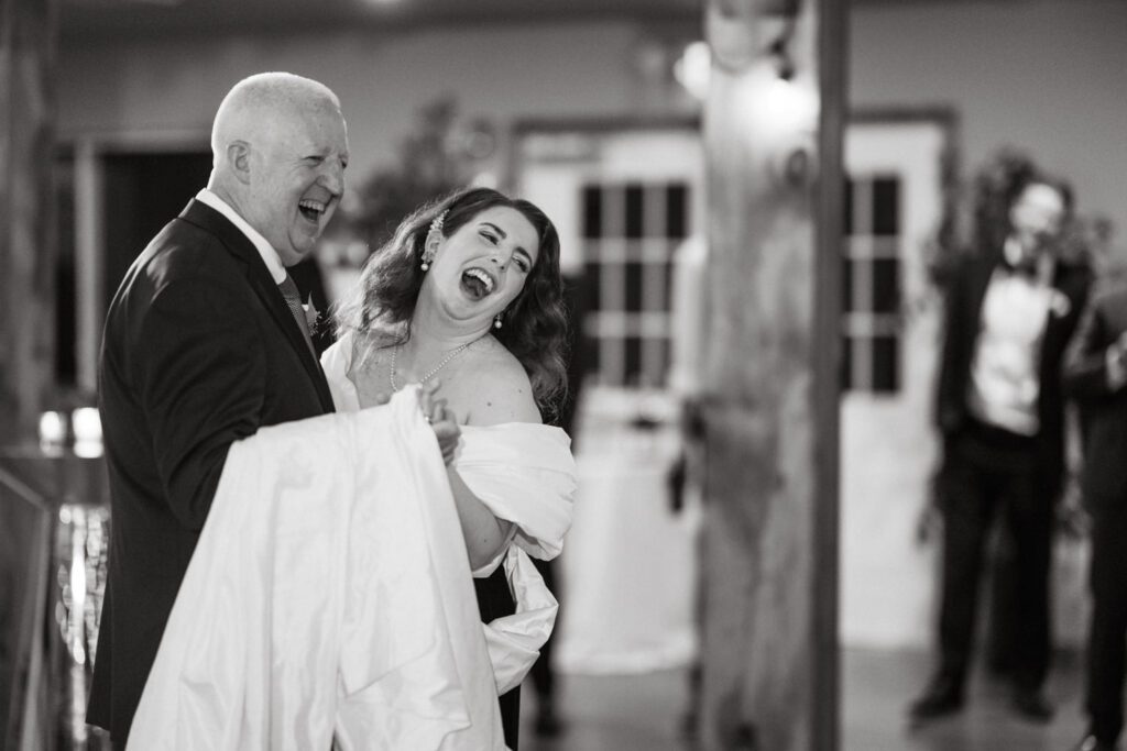 Kirsten and AJ’s September Wedding at Arrow Park, NY
Kirsten and AJ’s wedding day was a bit chilly and rainy, but their flexibility and positivity turned the day into a magical celebration. Originally planned for the garden, the ceremony was moved indoors due to the autumn rain. The staff at Arrow Park seamlessly transitioned the setup to the mansion’s main floor, creating an intimate and elegant ceremony space. The historic charm of the mansion, with its grand details and warm ambiance, added a cozy, romantic touch to their special day.
Kirsten, a talented fashion designer, surprised everyone—including her groom, AJ—by wearing a stunning black velvet strapless dress with an oversized white bow draping dramatically down the back. She designed the dress herself, and it was a show-stopper that perfectly reflected her unique style. The ceremony was heartfelt and personal, with family and friends gathering close to witness Kirsten and AJ’s vows.
After the ceremony, the main mansion was transformed to host a lively cocktail hour. Guests mingled and enjoyed delicious hors d'oeuvres while the reception space in the pavilion was being prepared. Kirsten and AJ’s attention to detail shone through in their décor choices, including the black-and-white checkered flooring that gave the pavilion a retro vibe. It was a perfect blend of modern chic and classic sophistication.
The reception began with Kirsten and AJ’s grand entrance, greeted by cheers from their guests. Their first dance was sweet and endearing, setting the tone for a night of joy and celebration. As the evening progressed, the party ramped up with enthusiastic dancing, heartfelt toasts, and even a surprise performance—a few uncles took the mic for an impromptu rap song that brought the house down.
Arrow Park provided the perfect backdrop for Kirsten and AJ’s wedding. With its blend of natural beauty and historic architecture, it’s an ideal venue for couples seeking a mix of indoor and outdoor spaces. The mansion offers a timeless elegance, while the pavilion provides a versatile setting for larger receptions.
Planning Tips for Future Couples at Arrow Park:
1. Have a Rain Plan: September weather can be unpredictable, so work with the Arrow Park staff to plan for both indoor and outdoor options. The mansion’s interiors provide a stunning alternative for ceremonies or cocktail hours.
2. Maximize the Pavilion: The pavilion’s spacious layout can accommodate various themes and setups. Consider unique flooring, lighting, or drapery to make the space your own.
3. Embrace the Venue’s Charm: Use the mansion’s historic features—like the fireplaces and vintage decor—as part of your wedding aesthetic. It’s a built-in backdrop that needs little embellishment.
4. Plan Time for Photos: Arrow Park’s grounds are breathtaking, especially in the fall. Schedule time with your photographer to capture the beauty of the lake, gardens, and mansion.
Kirsten and AJ’s wedding was a true testament to the power of creativity, adaptability, and love. Their celebration at Arrow Park was unforgettable, and I’m grateful to have been a part of their special day.
Thankful for all the wedding vendors that made this day possible:⁠
Venue: @arrowparkny
Catering: @lovenrosemary
Kirsten and AJ Arrow Park NY Wedding documented by Karis from Hey Karis New York, Brooklyn, Hudson Valley NY and Catskills NY and NJ Wedding and NYC Elopement Photographer.