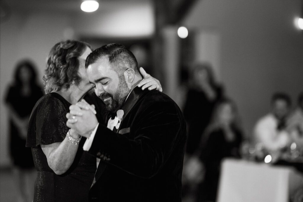 Kirsten and AJ’s September Wedding at Arrow Park, NY
Kirsten and AJ’s wedding day was a bit chilly and rainy, but their flexibility and positivity turned the day into a magical celebration. Originally planned for the garden, the ceremony was moved indoors due to the autumn rain. The staff at Arrow Park seamlessly transitioned the setup to the mansion’s main floor, creating an intimate and elegant ceremony space. The historic charm of the mansion, with its grand details and warm ambiance, added a cozy, romantic touch to their special day.
Kirsten, a talented fashion designer, surprised everyone—including her groom, AJ—by wearing a stunning black velvet strapless dress with an oversized white bow draping dramatically down the back. She designed the dress herself, and it was a show-stopper that perfectly reflected her unique style. The ceremony was heartfelt and personal, with family and friends gathering close to witness Kirsten and AJ’s vows.
After the ceremony, the main mansion was transformed to host a lively cocktail hour. Guests mingled and enjoyed delicious hors d'oeuvres while the reception space in the pavilion was being prepared. Kirsten and AJ’s attention to detail shone through in their décor choices, including the black-and-white checkered flooring that gave the pavilion a retro vibe. It was a perfect blend of modern chic and classic sophistication.
The reception began with Kirsten and AJ’s grand entrance, greeted by cheers from their guests. Their first dance was sweet and endearing, setting the tone for a night of joy and celebration. As the evening progressed, the party ramped up with enthusiastic dancing, heartfelt toasts, and even a surprise performance—a few uncles took the mic for an impromptu rap song that brought the house down.
Arrow Park provided the perfect backdrop for Kirsten and AJ’s wedding. With its blend of natural beauty and historic architecture, it’s an ideal venue for couples seeking a mix of indoor and outdoor spaces. The mansion offers a timeless elegance, while the pavilion provides a versatile setting for larger receptions.
Planning Tips for Future Couples at Arrow Park:
1. Have a Rain Plan: September weather can be unpredictable, so work with the Arrow Park staff to plan for both indoor and outdoor options. The mansion’s interiors provide a stunning alternative for ceremonies or cocktail hours.
2. Maximize the Pavilion: The pavilion’s spacious layout can accommodate various themes and setups. Consider unique flooring, lighting, or drapery to make the space your own.
3. Embrace the Venue’s Charm: Use the mansion’s historic features—like the fireplaces and vintage decor—as part of your wedding aesthetic. It’s a built-in backdrop that needs little embellishment.
4. Plan Time for Photos: Arrow Park’s grounds are breathtaking, especially in the fall. Schedule time with your photographer to capture the beauty of the lake, gardens, and mansion.
Kirsten and AJ’s wedding was a true testament to the power of creativity, adaptability, and love. Their celebration at Arrow Park was unforgettable, and I’m grateful to have been a part of their special day.
Thankful for all the wedding vendors that made this day possible:⁠
Venue: @arrowparkny
Catering: @lovenrosemary
Kirsten and AJ Arrow Park NY Wedding documented by Karis from Hey Karis New York, Brooklyn, Hudson Valley NY and Catskills NY and NJ Wedding and NYC Elopement Photographer.