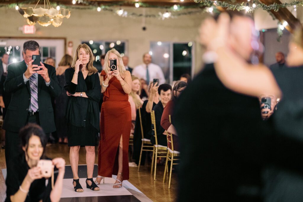 Kirsten and AJ’s September Wedding at Arrow Park, NY
Kirsten and AJ’s wedding day was a bit chilly and rainy, but their flexibility and positivity turned the day into a magical celebration. Originally planned for the garden, the ceremony was moved indoors due to the autumn rain. The staff at Arrow Park seamlessly transitioned the setup to the mansion’s main floor, creating an intimate and elegant ceremony space. The historic charm of the mansion, with its grand details and warm ambiance, added a cozy, romantic touch to their special day.
Kirsten, a talented fashion designer, surprised everyone—including her groom, AJ—by wearing a stunning black velvet strapless dress with an oversized white bow draping dramatically down the back. She designed the dress herself, and it was a show-stopper that perfectly reflected her unique style. The ceremony was heartfelt and personal, with family and friends gathering close to witness Kirsten and AJ’s vows.
After the ceremony, the main mansion was transformed to host a lively cocktail hour. Guests mingled and enjoyed delicious hors d'oeuvres while the reception space in the pavilion was being prepared. Kirsten and AJ’s attention to detail shone through in their décor choices, including the black-and-white checkered flooring that gave the pavilion a retro vibe. It was a perfect blend of modern chic and classic sophistication.
The reception began with Kirsten and AJ’s grand entrance, greeted by cheers from their guests. Their first dance was sweet and endearing, setting the tone for a night of joy and celebration. As the evening progressed, the party ramped up with enthusiastic dancing, heartfelt toasts, and even a surprise performance—a few uncles took the mic for an impromptu rap song that brought the house down.
Arrow Park provided the perfect backdrop for Kirsten and AJ’s wedding. With its blend of natural beauty and historic architecture, it’s an ideal venue for couples seeking a mix of indoor and outdoor spaces. The mansion offers a timeless elegance, while the pavilion provides a versatile setting for larger receptions.
Planning Tips for Future Couples at Arrow Park:
1. Have a Rain Plan: September weather can be unpredictable, so work with the Arrow Park staff to plan for both indoor and outdoor options. The mansion’s interiors provide a stunning alternative for ceremonies or cocktail hours.
2. Maximize the Pavilion: The pavilion’s spacious layout can accommodate various themes and setups. Consider unique flooring, lighting, or drapery to make the space your own.
3. Embrace the Venue’s Charm: Use the mansion’s historic features—like the fireplaces and vintage decor—as part of your wedding aesthetic. It’s a built-in backdrop that needs little embellishment.
4. Plan Time for Photos: Arrow Park’s grounds are breathtaking, especially in the fall. Schedule time with your photographer to capture the beauty of the lake, gardens, and mansion.
Kirsten and AJ’s wedding was a true testament to the power of creativity, adaptability, and love. Their celebration at Arrow Park was unforgettable, and I’m grateful to have been a part of their special day.
Thankful for all the wedding vendors that made this day possible:⁠
Venue: @arrowparkny
Catering: @lovenrosemary
Kirsten and AJ Arrow Park NY Wedding documented by Karis from Hey Karis New York, Brooklyn, Hudson Valley NY and Catskills NY and NJ Wedding and NYC Elopement Photographer.