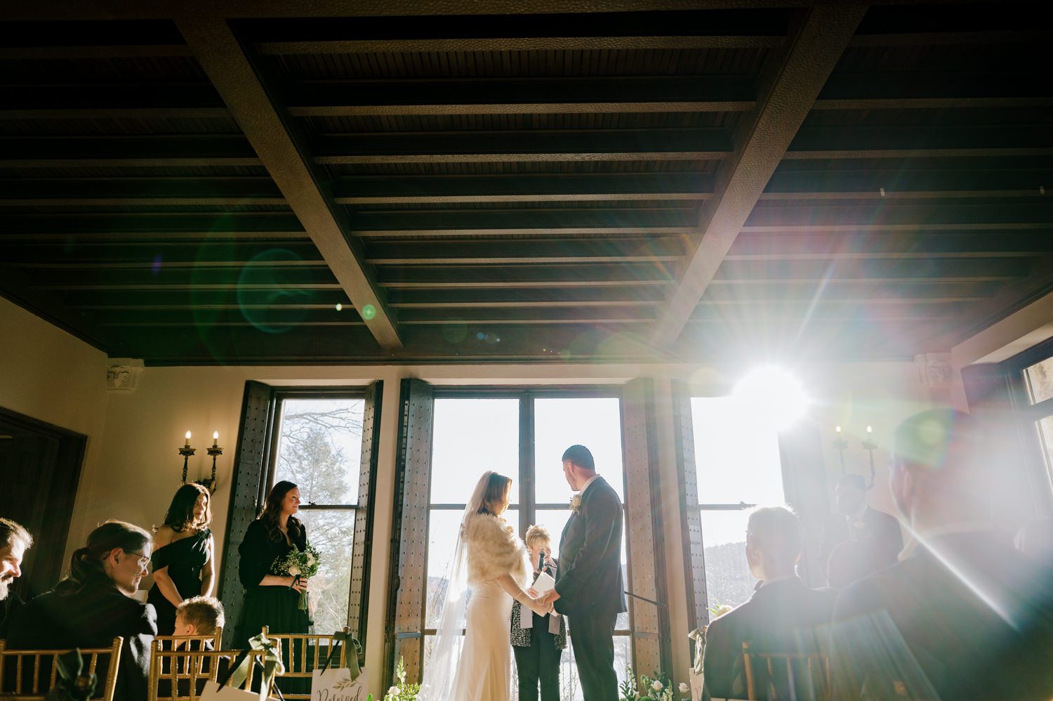 Kelsey and Liron Winter Wedding at Arrow Park, NY
My first wedding at Arrow Park was back in June 2022 when I had the pleasure of photographing Jackie and Aron’s wedding. From that moment, other wedding inquiries and opportunities arose, allowing me to capture the love stories of more wonderful couples at Arrow Park. That’s how I met Kelsey. Kelsey is the sales manager at Arrow Park, and since then, she has been a fan of my work. When it came time to plan her own wedding, I was delighted and honored that she chose me to document her beautiful celebration at Arrow Park.
Kelsey was well-prepared for the chilly weather, as she was getting married in December, so the wedding took place inside the mansion. When I arrived, Kelsey was finishing up her hair and makeup, just about ready to put on her dress. Families started to arrive, filling the space with warm greetings and laughter—one of my favorite scenes to witness on a wedding morning. Kelsey stepped into her dress, slipped on her gloves, and completed her final wedding preparations. She sparkled even more than the diamond on her finger as she walked over to see her groom.
As Kelsey walked down the aisle escorted by her father, emotions filled the room. Tears welled up in the eyes of their family and friends while Liron stood at the altar, watching her with a big smile. With their loved ones witnessing, Kelsey and Liron exchanged vows and sealed their marriage with a kiss.
Cocktail hour began with delicious hors d'oeuvres and drinks in hand, as guests excitedly welcomed the newlyweds into the room. Midway through the reception, Albanian dancers performed a traditional folk dance, bringing everyone to the dance floor as one big family. The night was filled with joy, laughter, and celebration. As all fun times do, the evening eventually came to an end, and we sent off Kelsey and Liron with a magical sparkler exit.
Winter Wedding Tips for Arrow Park, NY:
1. Embrace the Indoor Spaces: Arrow Park’s mansion provides an elegant and cozy setting for a winter wedding. The warm fireplaces and historic charm create a romantic atmosphere perfect for a chilly December day.
2. Prepare for the Cold: If you’re planning a winter wedding, consider stylish layers like faux fur wraps, long-sleeved dresses, or elegant gloves to stay warm while looking stunning.
3. Plan for Early Sunset: Winter days are shorter, so plan your timeline accordingly to make the most of natural light for photos. Consider a first look to capture beautiful portraits before it gets dark.
4. Add Seasonal Touches: Enhance the winter wedding ambiance with seasonal decor, such as candles, string lights, evergreen arrangements, and warm color palettes to complement the cozy indoor setting.
5. Offer Warm Beverages: Keep guests comfortable by serving hot cocoa, mulled wine, or warm cider during cocktail hour to add a festive and welcoming touch.
Kelsey and Liron’s wedding was a perfect example of how a winter celebration at Arrow Park can be both intimate and breathtaking. I was honored to capture their special day and look forward to photographing more magical winter weddings in this beautiful venue.
Kelsey and Liron's Arrow Park NY Wedding documented by Karis from Hey Karis New York, Brooklyn, Hudson Valley NY and Catskills NY and NJ Wedding and NYC Elopement Photographer.

