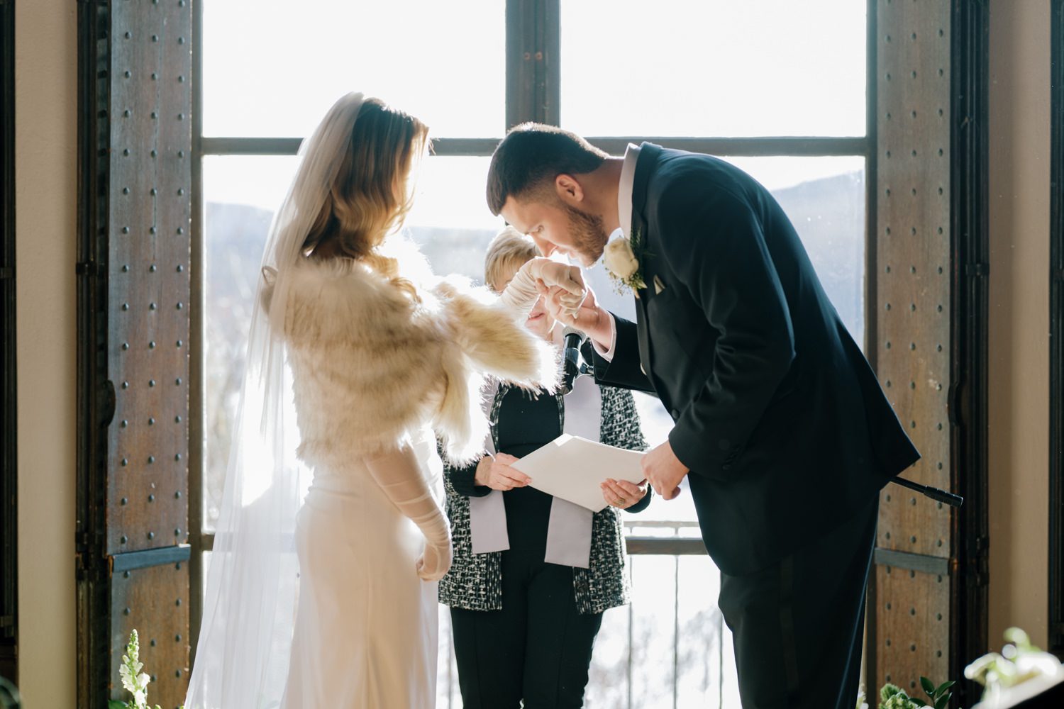 Kelsey and Liron Winter Wedding at Arrow Park, NY
My first wedding at Arrow Park was back in June 2022 when I had the pleasure of photographing Jackie and Aron’s wedding. From that moment, other wedding inquiries and opportunities arose, allowing me to capture the love stories of more wonderful couples at Arrow Park. That’s how I met Kelsey. Kelsey is the sales manager at Arrow Park, and since then, she has been a fan of my work. When it came time to plan her own wedding, I was delighted and honored that she chose me to document her beautiful celebration at Arrow Park.
Kelsey was well-prepared for the chilly weather, as she was getting married in December, so the wedding took place inside the mansion. When I arrived, Kelsey was finishing up her hair and makeup, just about ready to put on her dress. Families started to arrive, filling the space with warm greetings and laughter—one of my favorite scenes to witness on a wedding morning. Kelsey stepped into her dress, slipped on her gloves, and completed her final wedding preparations. She sparkled even more than the diamond on her finger as she walked over to see her groom.
As Kelsey walked down the aisle escorted by her father, emotions filled the room. Tears welled up in the eyes of their family and friends while Liron stood at the altar, watching her with a big smile. With their loved ones witnessing, Kelsey and Liron exchanged vows and sealed their marriage with a kiss.
Cocktail hour began with delicious hors d'oeuvres and drinks in hand, as guests excitedly welcomed the newlyweds into the room. Midway through the reception, Albanian dancers performed a traditional folk dance, bringing everyone to the dance floor as one big family. The night was filled with joy, laughter, and celebration. As all fun times do, the evening eventually came to an end, and we sent off Kelsey and Liron with a magical sparkler exit.
Winter Wedding Tips for Arrow Park, NY:
1. Embrace the Indoor Spaces: Arrow Park’s mansion provides an elegant and cozy setting for a winter wedding. The warm fireplaces and historic charm create a romantic atmosphere perfect for a chilly December day.
2. Prepare for the Cold: If you’re planning a winter wedding, consider stylish layers like faux fur wraps, long-sleeved dresses, or elegant gloves to stay warm while looking stunning.
3. Plan for Early Sunset: Winter days are shorter, so plan your timeline accordingly to make the most of natural light for photos. Consider a first look to capture beautiful portraits before it gets dark.
4. Add Seasonal Touches: Enhance the winter wedding ambiance with seasonal decor, such as candles, string lights, evergreen arrangements, and warm color palettes to complement the cozy indoor setting.
5. Offer Warm Beverages: Keep guests comfortable by serving hot cocoa, mulled wine, or warm cider during cocktail hour to add a festive and welcoming touch.
Kelsey and Liron’s wedding was a perfect example of how a winter celebration at Arrow Park can be both intimate and breathtaking. I was honored to capture their special day and look forward to photographing more magical winter weddings in this beautiful venue.
Kelsey and Liron's Arrow Park NY Wedding documented by Karis from Hey Karis New York, Brooklyn, Hudson Valley NY and Catskills NY and NJ Wedding and NYC Elopement Photographer.
