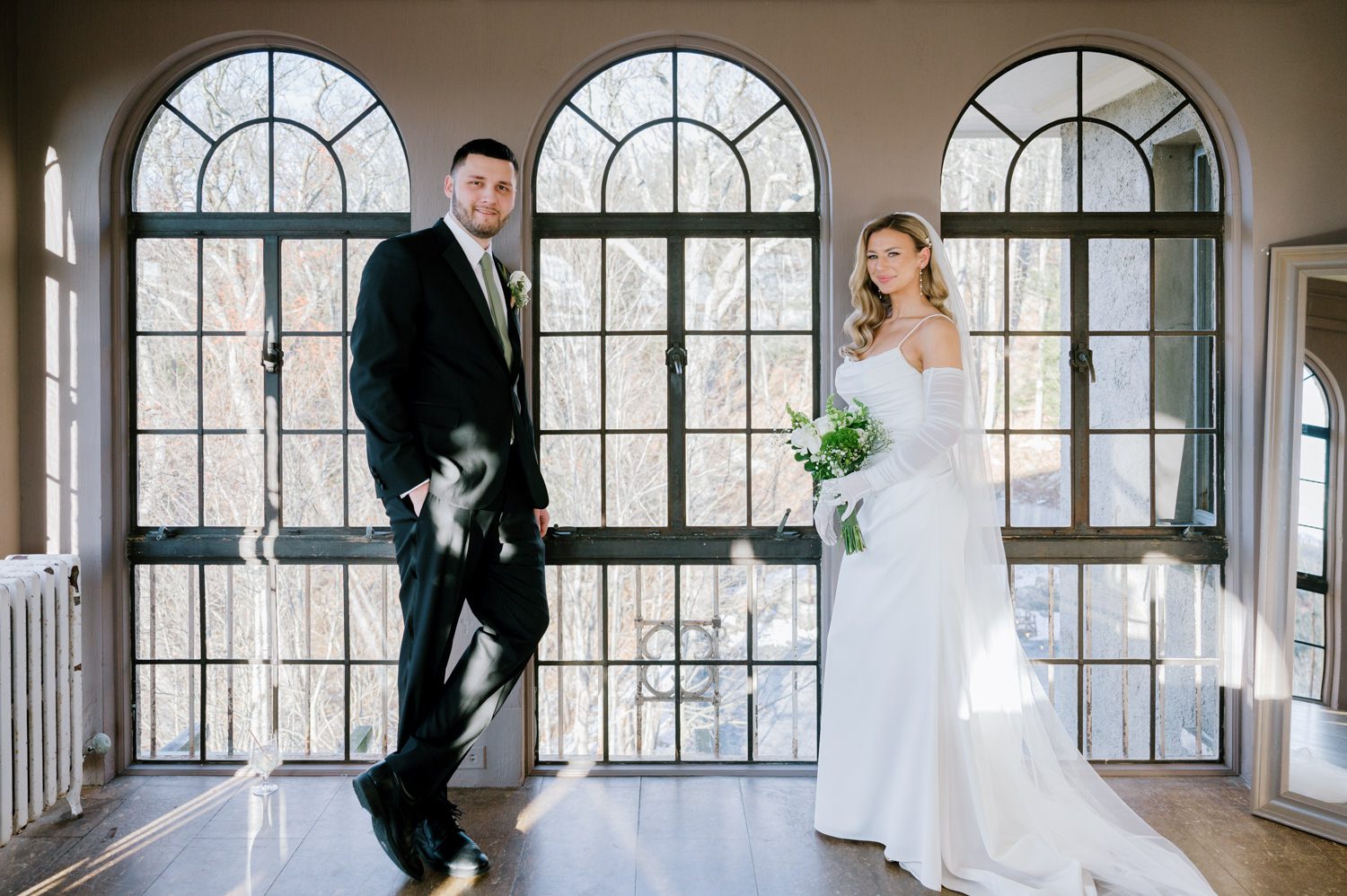 Kelsey and Liron Winter Wedding at Arrow Park, NY
My first wedding at Arrow Park was back in June 2022 when I had the pleasure of photographing Jackie and Aron’s wedding. From that moment, other wedding inquiries and opportunities arose, allowing me to capture the love stories of more wonderful couples at Arrow Park. That’s how I met Kelsey. Kelsey is the sales manager at Arrow Park, and since then, she has been a fan of my work. When it came time to plan her own wedding, I was delighted and honored that she chose me to document her beautiful celebration at Arrow Park.
Kelsey was well-prepared for the chilly weather, as she was getting married in December, so the wedding took place inside the mansion. When I arrived, Kelsey was finishing up her hair and makeup, just about ready to put on her dress. Families started to arrive, filling the space with warm greetings and laughter—one of my favorite scenes to witness on a wedding morning. Kelsey stepped into her dress, slipped on her gloves, and completed her final wedding preparations. She sparkled even more than the diamond on her finger as she walked over to see her groom.
As Kelsey walked down the aisle escorted by her father, emotions filled the room. Tears welled up in the eyes of their family and friends while Liron stood at the altar, watching her with a big smile. With their loved ones witnessing, Kelsey and Liron exchanged vows and sealed their marriage with a kiss.
Cocktail hour began with delicious hors d'oeuvres and drinks in hand, as guests excitedly welcomed the newlyweds into the room. Midway through the reception, Albanian dancers performed a traditional folk dance, bringing everyone to the dance floor as one big family. The night was filled with joy, laughter, and celebration. As all fun times do, the evening eventually came to an end, and we sent off Kelsey and Liron with a magical sparkler exit.
Winter Wedding Tips for Arrow Park, NY:
1. Embrace the Indoor Spaces: Arrow Park’s mansion provides an elegant and cozy setting for a winter wedding. The warm fireplaces and historic charm create a romantic atmosphere perfect for a chilly December day.
2. Prepare for the Cold: If you’re planning a winter wedding, consider stylish layers like faux fur wraps, long-sleeved dresses, or elegant gloves to stay warm while looking stunning.
3. Plan for Early Sunset: Winter days are shorter, so plan your timeline accordingly to make the most of natural light for photos. Consider a first look to capture beautiful portraits before it gets dark.
4. Add Seasonal Touches: Enhance the winter wedding ambiance with seasonal decor, such as candles, string lights, evergreen arrangements, and warm color palettes to complement the cozy indoor setting.
5. Offer Warm Beverages: Keep guests comfortable by serving hot cocoa, mulled wine, or warm cider during cocktail hour to add a festive and welcoming touch.
Kelsey and Liron’s wedding was a perfect example of how a winter celebration at Arrow Park can be both intimate and breathtaking. I was honored to capture their special day and look forward to photographing more magical winter weddings in this beautiful venue.
Kelsey and Liron's Arrow Park NY Wedding documented by Karis from Hey Karis New York, Brooklyn, Hudson Valley NY and Catskills NY and NJ Wedding and NYC Elopement Photographer.
