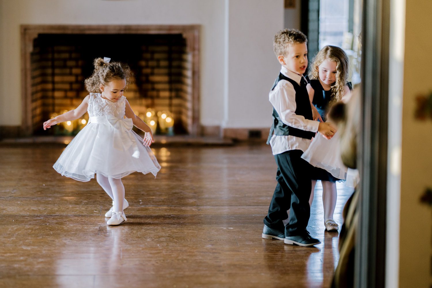 Kelsey and Liron Winter Wedding at Arrow Park, NY
My first wedding at Arrow Park was back in June 2022 when I had the pleasure of photographing Jackie and Aron’s wedding. From that moment, other wedding inquiries and opportunities arose, allowing me to capture the love stories of more wonderful couples at Arrow Park. That’s how I met Kelsey. Kelsey is the sales manager at Arrow Park, and since then, she has been a fan of my work. When it came time to plan her own wedding, I was delighted and honored that she chose me to document her beautiful celebration at Arrow Park.
Kelsey was well-prepared for the chilly weather, as she was getting married in December, so the wedding took place inside the mansion. When I arrived, Kelsey was finishing up her hair and makeup, just about ready to put on her dress. Families started to arrive, filling the space with warm greetings and laughter—one of my favorite scenes to witness on a wedding morning. Kelsey stepped into her dress, slipped on her gloves, and completed her final wedding preparations. She sparkled even more than the diamond on her finger as she walked over to see her groom.
As Kelsey walked down the aisle escorted by her father, emotions filled the room. Tears welled up in the eyes of their family and friends while Liron stood at the altar, watching her with a big smile. With their loved ones witnessing, Kelsey and Liron exchanged vows and sealed their marriage with a kiss.
Cocktail hour began with delicious hors d'oeuvres and drinks in hand, as guests excitedly welcomed the newlyweds into the room. Midway through the reception, Albanian dancers performed a traditional folk dance, bringing everyone to the dance floor as one big family. The night was filled with joy, laughter, and celebration. As all fun times do, the evening eventually came to an end, and we sent off Kelsey and Liron with a magical sparkler exit.
Winter Wedding Tips for Arrow Park, NY:
1. Embrace the Indoor Spaces: Arrow Park’s mansion provides an elegant and cozy setting for a winter wedding. The warm fireplaces and historic charm create a romantic atmosphere perfect for a chilly December day.
2. Prepare for the Cold: If you’re planning a winter wedding, consider stylish layers like faux fur wraps, long-sleeved dresses, or elegant gloves to stay warm while looking stunning.
3. Plan for Early Sunset: Winter days are shorter, so plan your timeline accordingly to make the most of natural light for photos. Consider a first look to capture beautiful portraits before it gets dark.
4. Add Seasonal Touches: Enhance the winter wedding ambiance with seasonal decor, such as candles, string lights, evergreen arrangements, and warm color palettes to complement the cozy indoor setting.
5. Offer Warm Beverages: Keep guests comfortable by serving hot cocoa, mulled wine, or warm cider during cocktail hour to add a festive and welcoming touch.
Kelsey and Liron’s wedding was a perfect example of how a winter celebration at Arrow Park can be both intimate and breathtaking. I was honored to capture their special day and look forward to photographing more magical winter weddings in this beautiful venue.
Kelsey and Liron's Arrow Park NY Wedding documented by Karis from Hey Karis New York, Brooklyn, Hudson Valley NY and Catskills NY and NJ Wedding and NYC Elopement Photographer.
