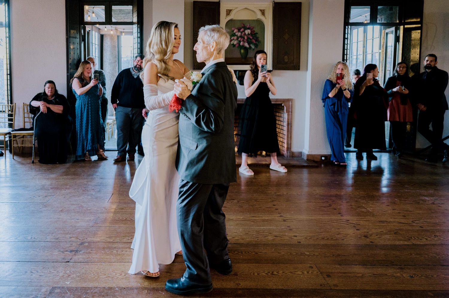 Kelsey and Liron Winter Wedding at Arrow Park, NY
My first wedding at Arrow Park was back in June 2022 when I had the pleasure of photographing Jackie and Aron’s wedding. From that moment, other wedding inquiries and opportunities arose, allowing me to capture the love stories of more wonderful couples at Arrow Park. That’s how I met Kelsey. Kelsey is the sales manager at Arrow Park, and since then, she has been a fan of my work. When it came time to plan her own wedding, I was delighted and honored that she chose me to document her beautiful celebration at Arrow Park.
Kelsey was well-prepared for the chilly weather, as she was getting married in December, so the wedding took place inside the mansion. When I arrived, Kelsey was finishing up her hair and makeup, just about ready to put on her dress. Families started to arrive, filling the space with warm greetings and laughter—one of my favorite scenes to witness on a wedding morning. Kelsey stepped into her dress, slipped on her gloves, and completed her final wedding preparations. She sparkled even more than the diamond on her finger as she walked over to see her groom.
As Kelsey walked down the aisle escorted by her father, emotions filled the room. Tears welled up in the eyes of their family and friends while Liron stood at the altar, watching her with a big smile. With their loved ones witnessing, Kelsey and Liron exchanged vows and sealed their marriage with a kiss.
Cocktail hour began with delicious hors d'oeuvres and drinks in hand, as guests excitedly welcomed the newlyweds into the room. Midway through the reception, Albanian dancers performed a traditional folk dance, bringing everyone to the dance floor as one big family. The night was filled with joy, laughter, and celebration. As all fun times do, the evening eventually came to an end, and we sent off Kelsey and Liron with a magical sparkler exit.
Winter Wedding Tips for Arrow Park, NY:
1. Embrace the Indoor Spaces: Arrow Park’s mansion provides an elegant and cozy setting for a winter wedding. The warm fireplaces and historic charm create a romantic atmosphere perfect for a chilly December day.
2. Prepare for the Cold: If you’re planning a winter wedding, consider stylish layers like faux fur wraps, long-sleeved dresses, or elegant gloves to stay warm while looking stunning.
3. Plan for Early Sunset: Winter days are shorter, so plan your timeline accordingly to make the most of natural light for photos. Consider a first look to capture beautiful portraits before it gets dark.
4. Add Seasonal Touches: Enhance the winter wedding ambiance with seasonal decor, such as candles, string lights, evergreen arrangements, and warm color palettes to complement the cozy indoor setting.
5. Offer Warm Beverages: Keep guests comfortable by serving hot cocoa, mulled wine, or warm cider during cocktail hour to add a festive and welcoming touch.
Kelsey and Liron’s wedding was a perfect example of how a winter celebration at Arrow Park can be both intimate and breathtaking. I was honored to capture their special day and look forward to photographing more magical winter weddings in this beautiful venue.
Kelsey and Liron's Arrow Park NY Wedding documented by Karis from Hey Karis New York, Brooklyn, Hudson Valley NY and Catskills NY and NJ Wedding and NYC Elopement Photographer.
