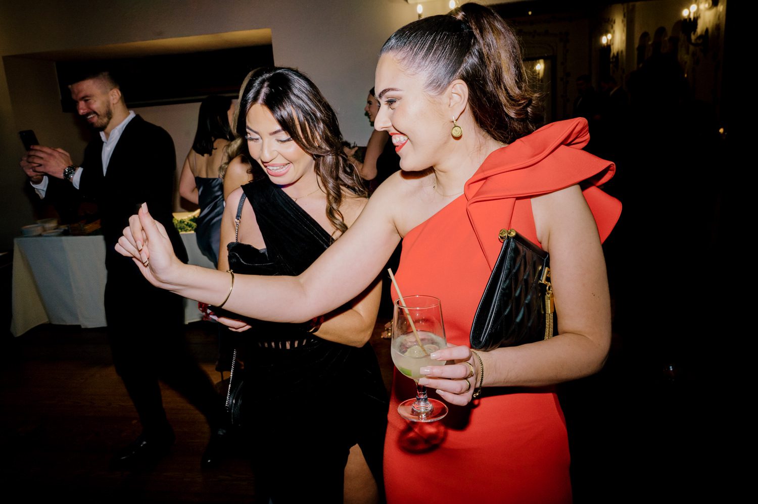 Kelsey and Liron Winter Wedding at Arrow Park, NY
My first wedding at Arrow Park was back in June 2022 when I had the pleasure of photographing Jackie and Aron’s wedding. From that moment, other wedding inquiries and opportunities arose, allowing me to capture the love stories of more wonderful couples at Arrow Park. That’s how I met Kelsey. Kelsey is the sales manager at Arrow Park, and since then, she has been a fan of my work. When it came time to plan her own wedding, I was delighted and honored that she chose me to document her beautiful celebration at Arrow Park.
Kelsey was well-prepared for the chilly weather, as she was getting married in December, so the wedding took place inside the mansion. When I arrived, Kelsey was finishing up her hair and makeup, just about ready to put on her dress. Families started to arrive, filling the space with warm greetings and laughter—one of my favorite scenes to witness on a wedding morning. Kelsey stepped into her dress, slipped on her gloves, and completed her final wedding preparations. She sparkled even more than the diamond on her finger as she walked over to see her groom.
As Kelsey walked down the aisle escorted by her father, emotions filled the room. Tears welled up in the eyes of their family and friends while Liron stood at the altar, watching her with a big smile. With their loved ones witnessing, Kelsey and Liron exchanged vows and sealed their marriage with a kiss.
Cocktail hour began with delicious hors d'oeuvres and drinks in hand, as guests excitedly welcomed the newlyweds into the room. Midway through the reception, Albanian dancers performed a traditional folk dance, bringing everyone to the dance floor as one big family. The night was filled with joy, laughter, and celebration. As all fun times do, the evening eventually came to an end, and we sent off Kelsey and Liron with a magical sparkler exit.
Winter Wedding Tips for Arrow Park, NY:
1. Embrace the Indoor Spaces: Arrow Park’s mansion provides an elegant and cozy setting for a winter wedding. The warm fireplaces and historic charm create a romantic atmosphere perfect for a chilly December day.
2. Prepare for the Cold: If you’re planning a winter wedding, consider stylish layers like faux fur wraps, long-sleeved dresses, or elegant gloves to stay warm while looking stunning.
3. Plan for Early Sunset: Winter days are shorter, so plan your timeline accordingly to make the most of natural light for photos. Consider a first look to capture beautiful portraits before it gets dark.
4. Add Seasonal Touches: Enhance the winter wedding ambiance with seasonal decor, such as candles, string lights, evergreen arrangements, and warm color palettes to complement the cozy indoor setting.
5. Offer Warm Beverages: Keep guests comfortable by serving hot cocoa, mulled wine, or warm cider during cocktail hour to add a festive and welcoming touch.
Kelsey and Liron’s wedding was a perfect example of how a winter celebration at Arrow Park can be both intimate and breathtaking. I was honored to capture their special day and look forward to photographing more magical winter weddings in this beautiful venue.
Kelsey and Liron's Arrow Park NY Wedding documented by Karis from Hey Karis New York, Brooklyn, Hudson Valley NY and Catskills NY and NJ Wedding and NYC Elopement Photographer.
