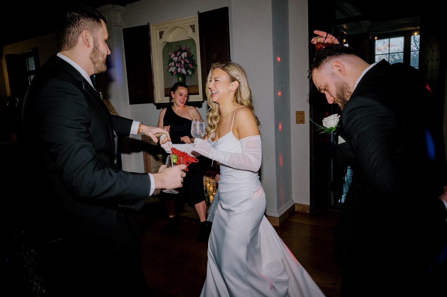 Kelsey and Liron Winter Wedding at Arrow Park, NY
My first wedding at Arrow Park was back in June 2022 when I had the pleasure of photographing Jackie and Aron’s wedding. From that moment, other wedding inquiries and opportunities arose, allowing me to capture the love stories of more wonderful couples at Arrow Park. That’s how I met Kelsey. Kelsey is the sales manager at Arrow Park, and since then, she has been a fan of my work. When it came time to plan her own wedding, I was delighted and honored that she chose me to document her beautiful celebration at Arrow Park.
Kelsey was well-prepared for the chilly weather, as she was getting married in December, so the wedding took place inside the mansion. When I arrived, Kelsey was finishing up her hair and makeup, just about ready to put on her dress. Families started to arrive, filling the space with warm greetings and laughter—one of my favorite scenes to witness on a wedding morning. Kelsey stepped into her dress, slipped on her gloves, and completed her final wedding preparations. She sparkled even more than the diamond on her finger as she walked over to see her groom.
As Kelsey walked down the aisle escorted by her father, emotions filled the room. Tears welled up in the eyes of their family and friends while Liron stood at the altar, watching her with a big smile. With their loved ones witnessing, Kelsey and Liron exchanged vows and sealed their marriage with a kiss.
Cocktail hour began with delicious hors d'oeuvres and drinks in hand, as guests excitedly welcomed the newlyweds into the room. Midway through the reception, Albanian dancers performed a traditional folk dance, bringing everyone to the dance floor as one big family. The night was filled with joy, laughter, and celebration. As all fun times do, the evening eventually came to an end, and we sent off Kelsey and Liron with a magical sparkler exit.
Winter Wedding Tips for Arrow Park, NY:
1. Embrace the Indoor Spaces: Arrow Park’s mansion provides an elegant and cozy setting for a winter wedding. The warm fireplaces and historic charm create a romantic atmosphere perfect for a chilly December day.
2. Prepare for the Cold: If you’re planning a winter wedding, consider stylish layers like faux fur wraps, long-sleeved dresses, or elegant gloves to stay warm while looking stunning.
3. Plan for Early Sunset: Winter days are shorter, so plan your timeline accordingly to make the most of natural light for photos. Consider a first look to capture beautiful portraits before it gets dark.
4. Add Seasonal Touches: Enhance the winter wedding ambiance with seasonal decor, such as candles, string lights, evergreen arrangements, and warm color palettes to complement the cozy indoor setting.
5. Offer Warm Beverages: Keep guests comfortable by serving hot cocoa, mulled wine, or warm cider during cocktail hour to add a festive and welcoming touch.
Kelsey and Liron’s wedding was a perfect example of how a winter celebration at Arrow Park can be both intimate and breathtaking. I was honored to capture their special day and look forward to photographing more magical winter weddings in this beautiful venue.
Kelsey and Liron's Arrow Park NY Wedding documented by Karis from Hey Karis New York, Brooklyn, Hudson Valley NY and Catskills NY and NJ Wedding and NYC Elopement Photographer.
